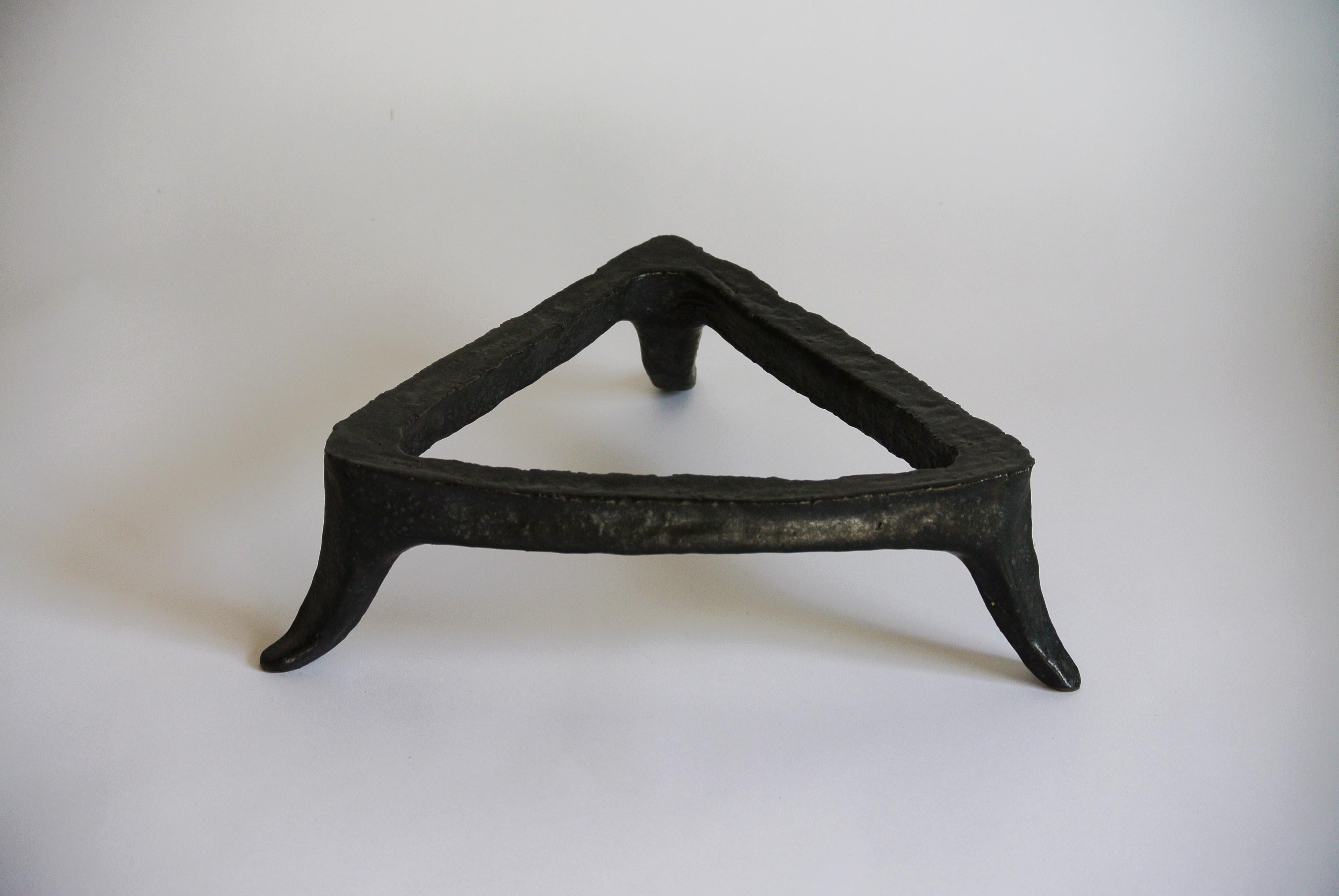 Grey stoneware trivet with chamotte and black metallic glaze hand build by Danish Artist Christine Roland. A one-of-a-kind decorative object.