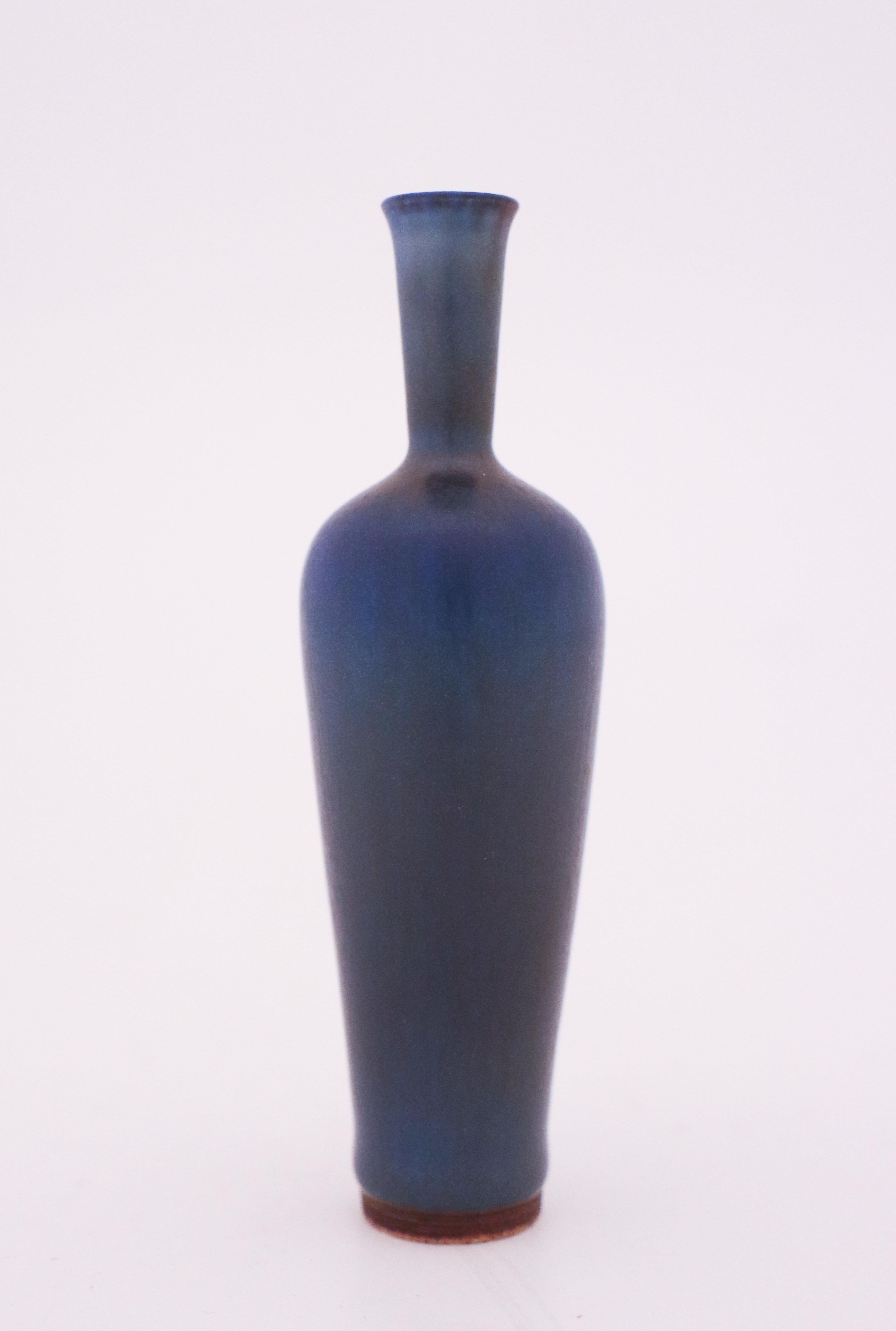 A lovely blue vase designed by Berndt Friberg at Gustavsberg in Stockholm, the vase is 10 cm high with a lovely harfur glase. It's marked as on picture and was made in 1962 and it is in mint condition.