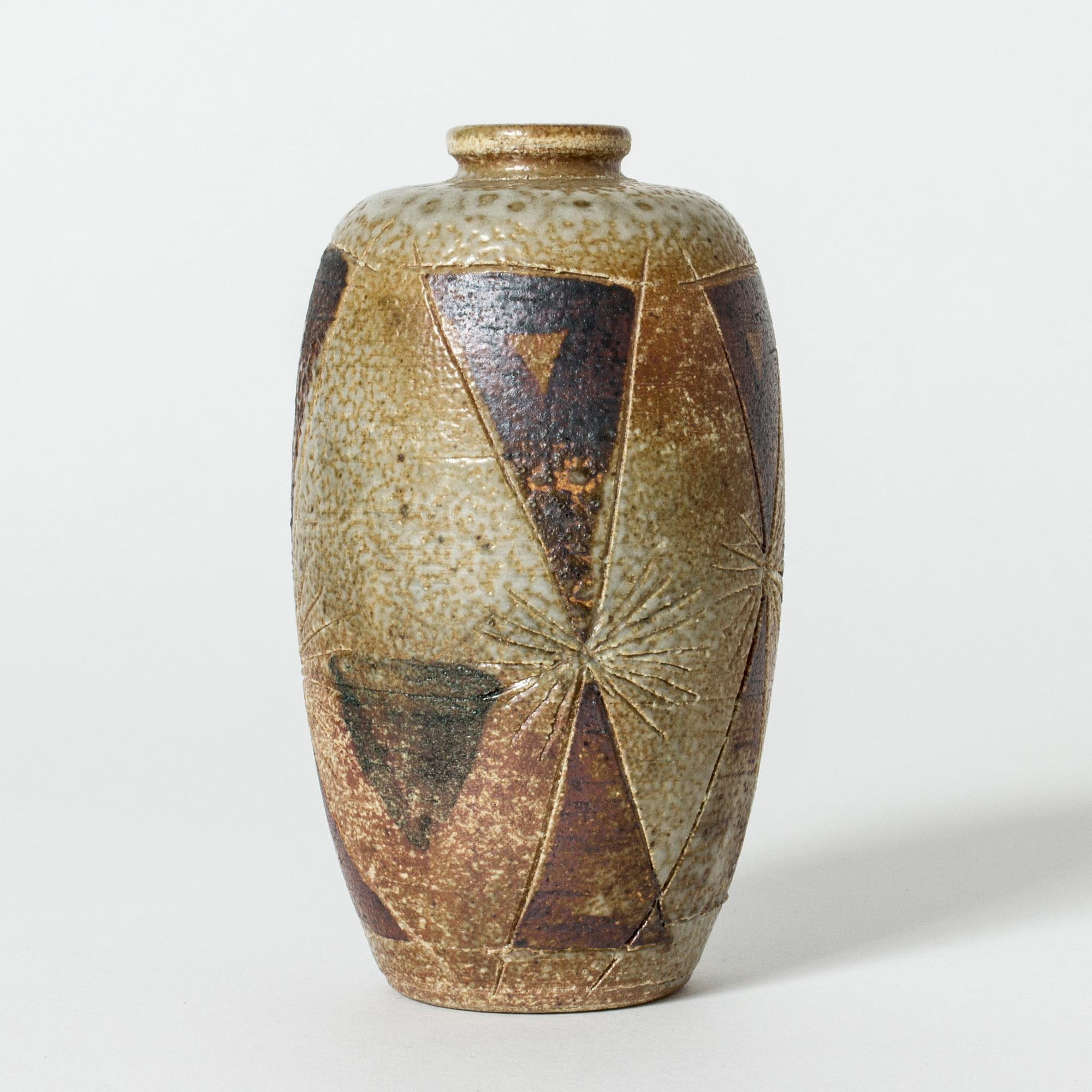 Beautiful stoneware vase by Anders B. Liljefors, in a sleek form with a structured surface. Decor of etched stars and symbols that give the vase a mystical expression.

Anders B. Liljefors was a Swedish ceramicist, sculptor and painter. He spent a