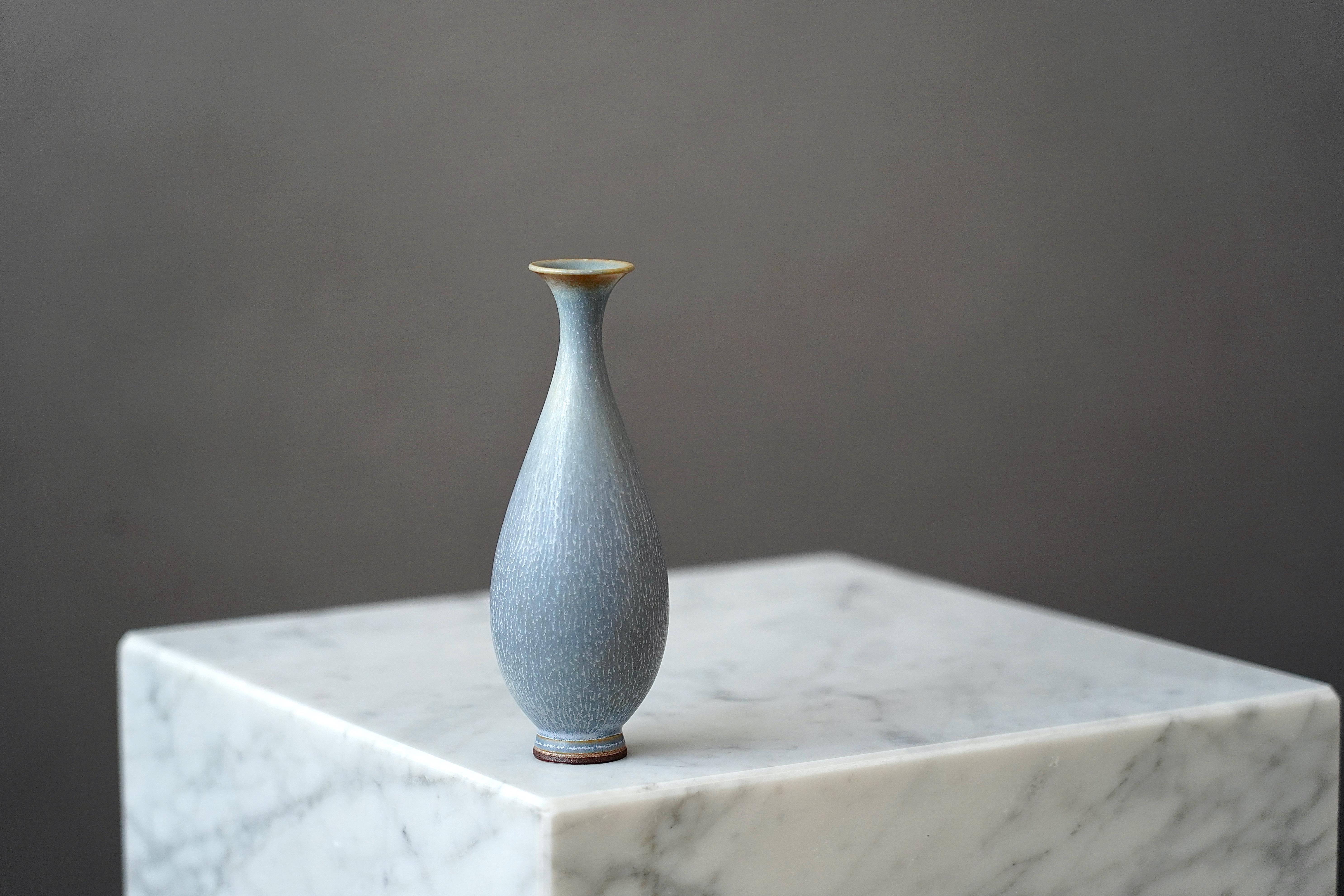 A beautiful stoneware vase with amazing hare’s fur glaze.
Made by master thrower Berndt Friberg, in the artist's studio at Gustavsberg, Sweden.

Great condition. Incised signature 