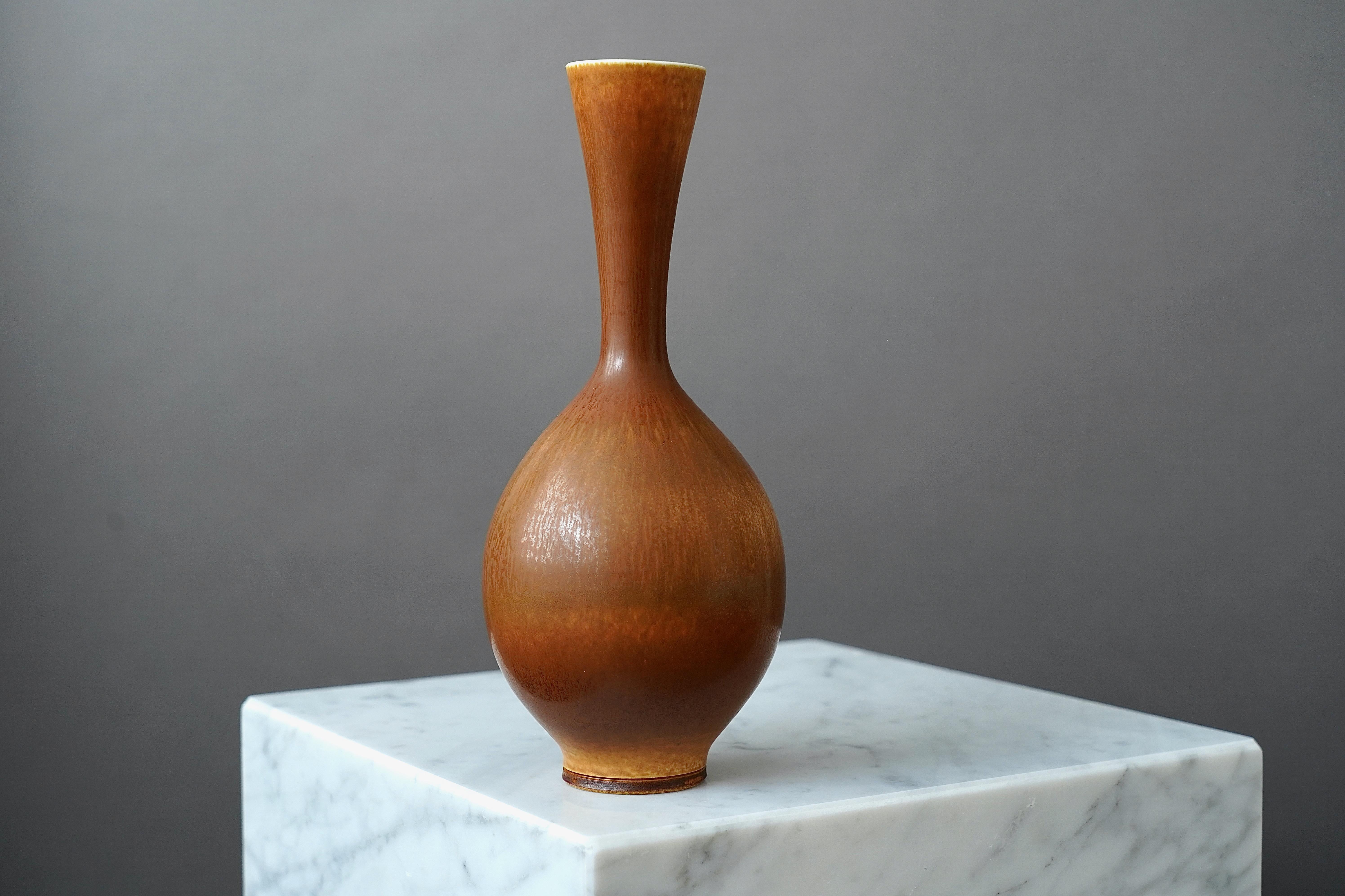 A beautiful stoneware vase with amazing hare’s fur glaze.
Made by master thrower Berndt Friberg, in the artist's studio at Gustavsberg, Sweden.

Excellent condition. Incised signature 