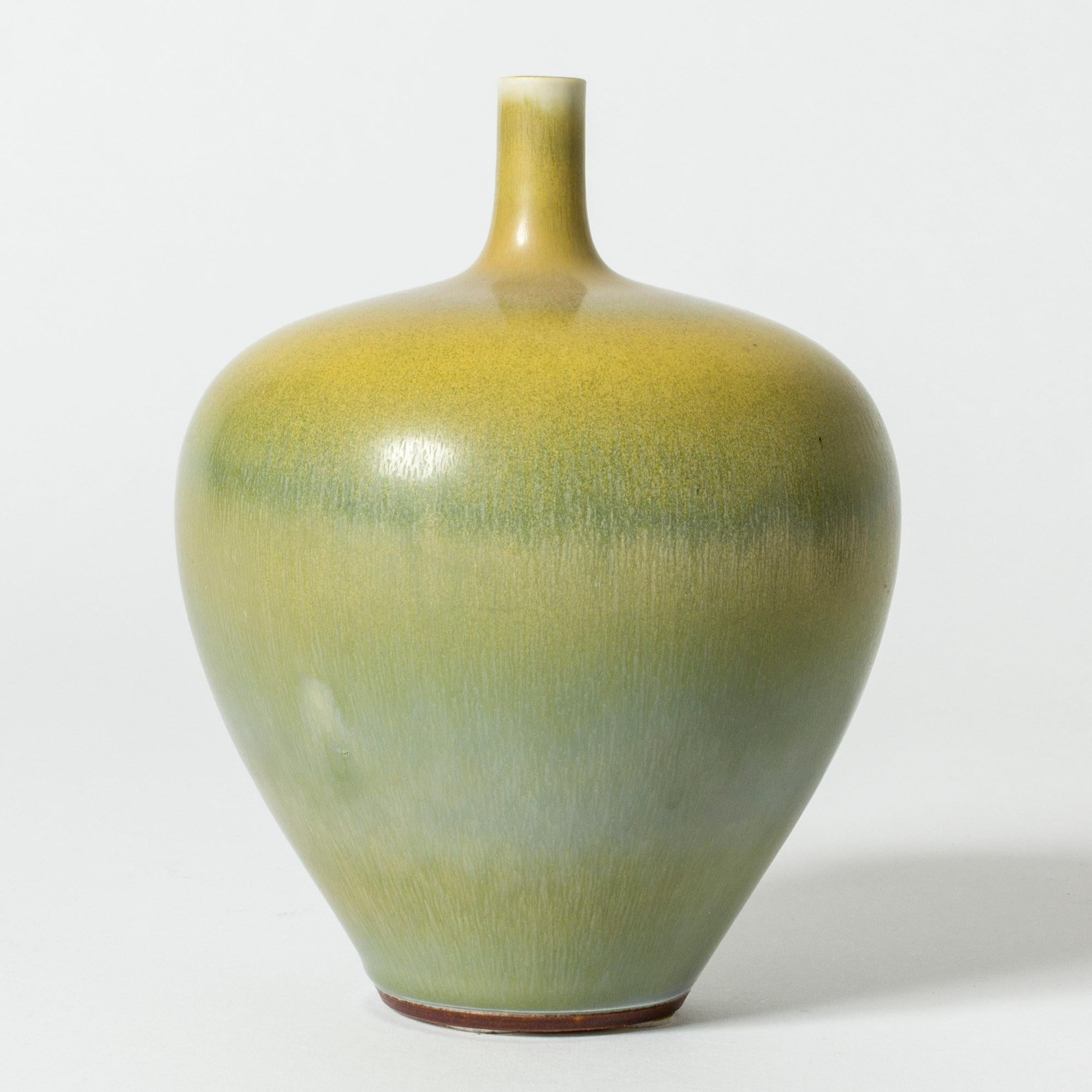 Amazing stoneware vase by Berndt Friberg, in a elegant apple form. Vibrant hare’s fur glaze in nuances of yellow, green and turquoise.

Berndt Friberg was a Swedish ceramicist, renowned for his stoneware vases and vessels for Gustavsberg. His