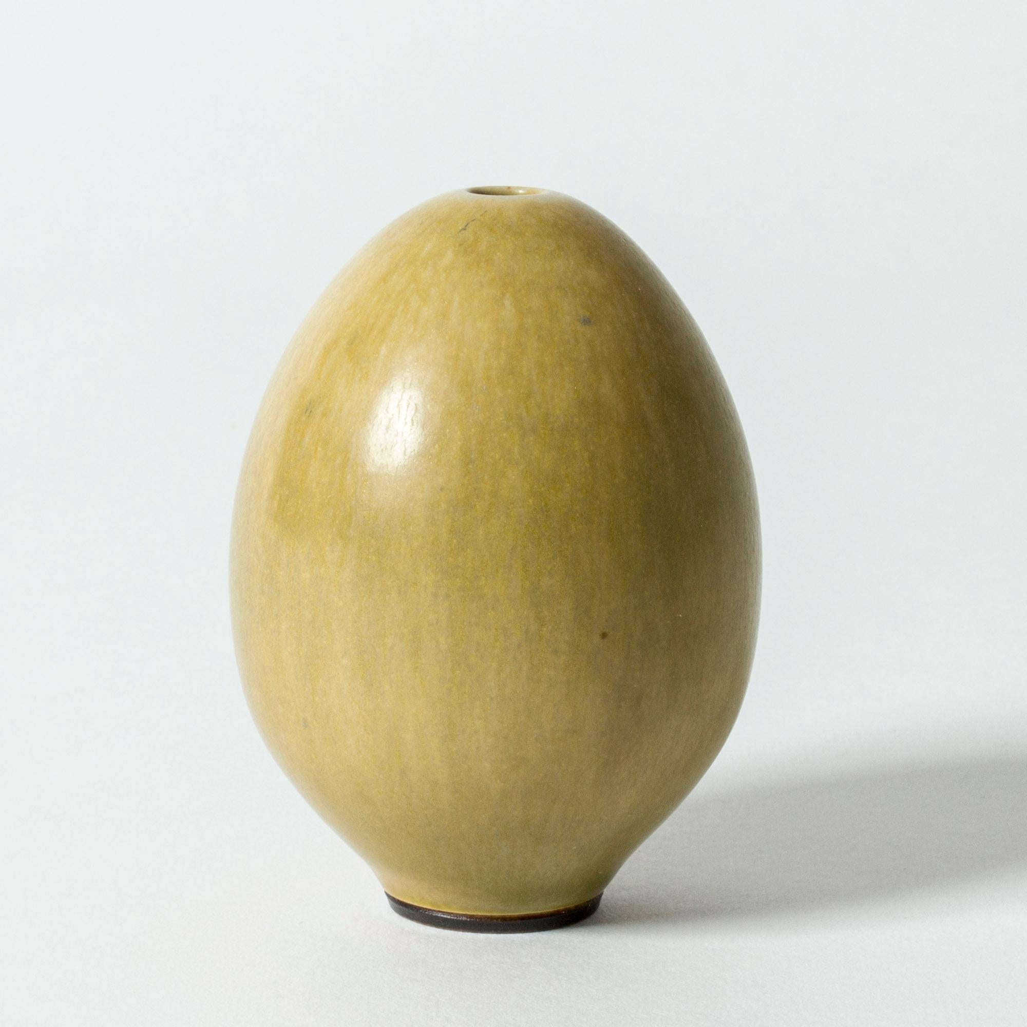 Lovely, small stoneware vase by Berndt Friberg, in the form of an egg. Delicately made, with yellow hare’s fur glaze.

Berndt Friberg was a Swedish ceramicist, renowned for his stoneware vases and vessels for Gustavsberg. His pure, composed designs