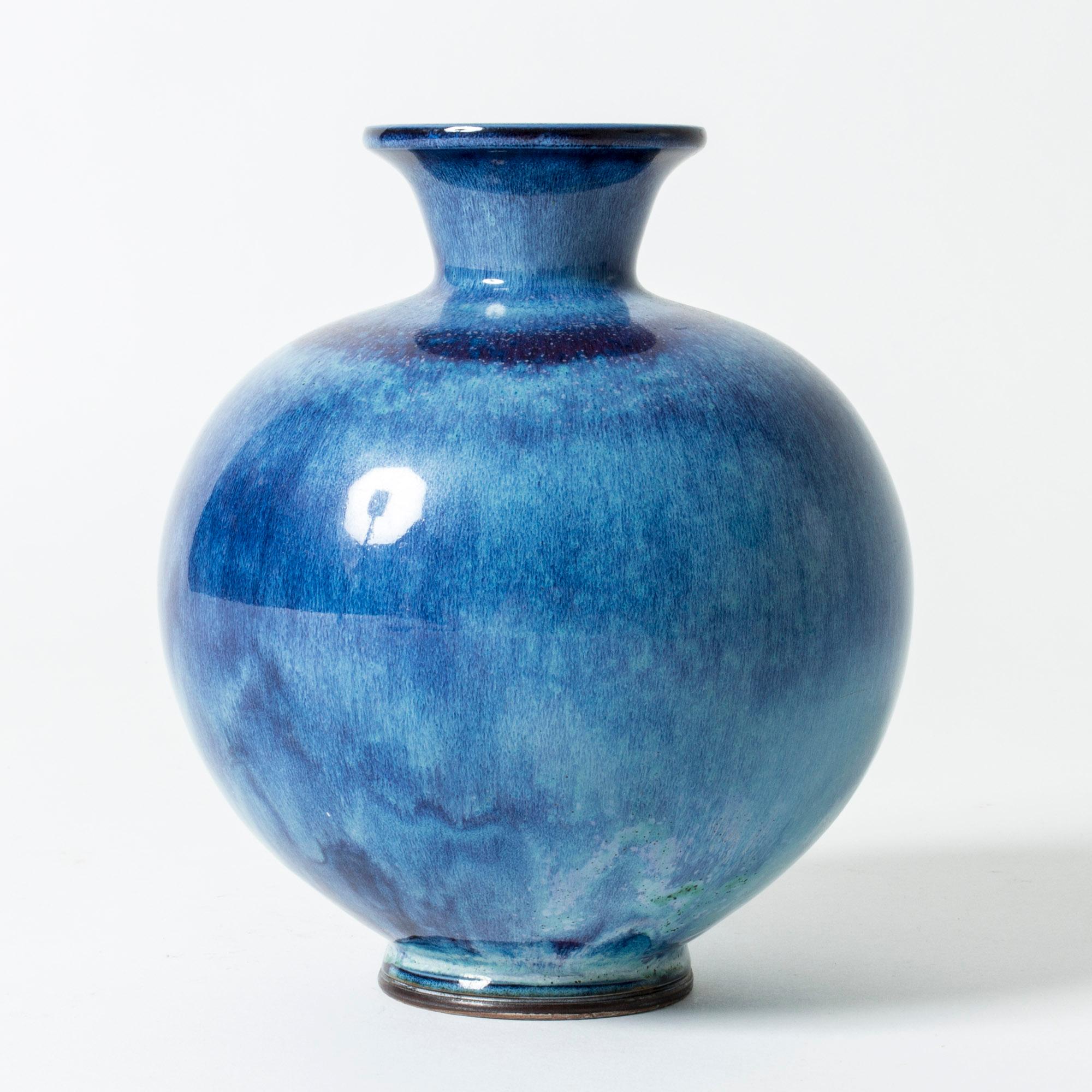 Beautiful stoneware vase by Berndt Friberg in a plump design. Vibrant “Aniara” glaze in bright blue with a meandering pattern in different hues.

Berndt Friberg was a Swedish ceramicist, renowned for his stoneware vases and vessels for