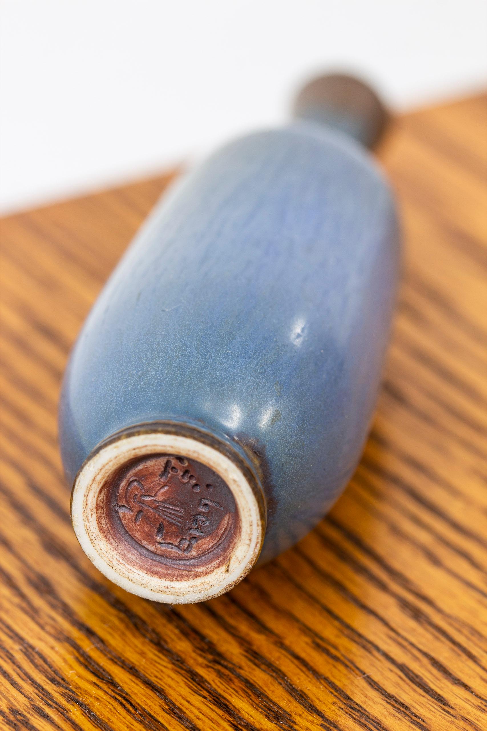 Stoneware vase designed by Berndt Friberg. Hand made at Gustavsbergs Studio, ca 1950s. Hand turned with glaze shifting in various blue, grey and brown tones. Very good condition without damages or defects. Signed as pictured.