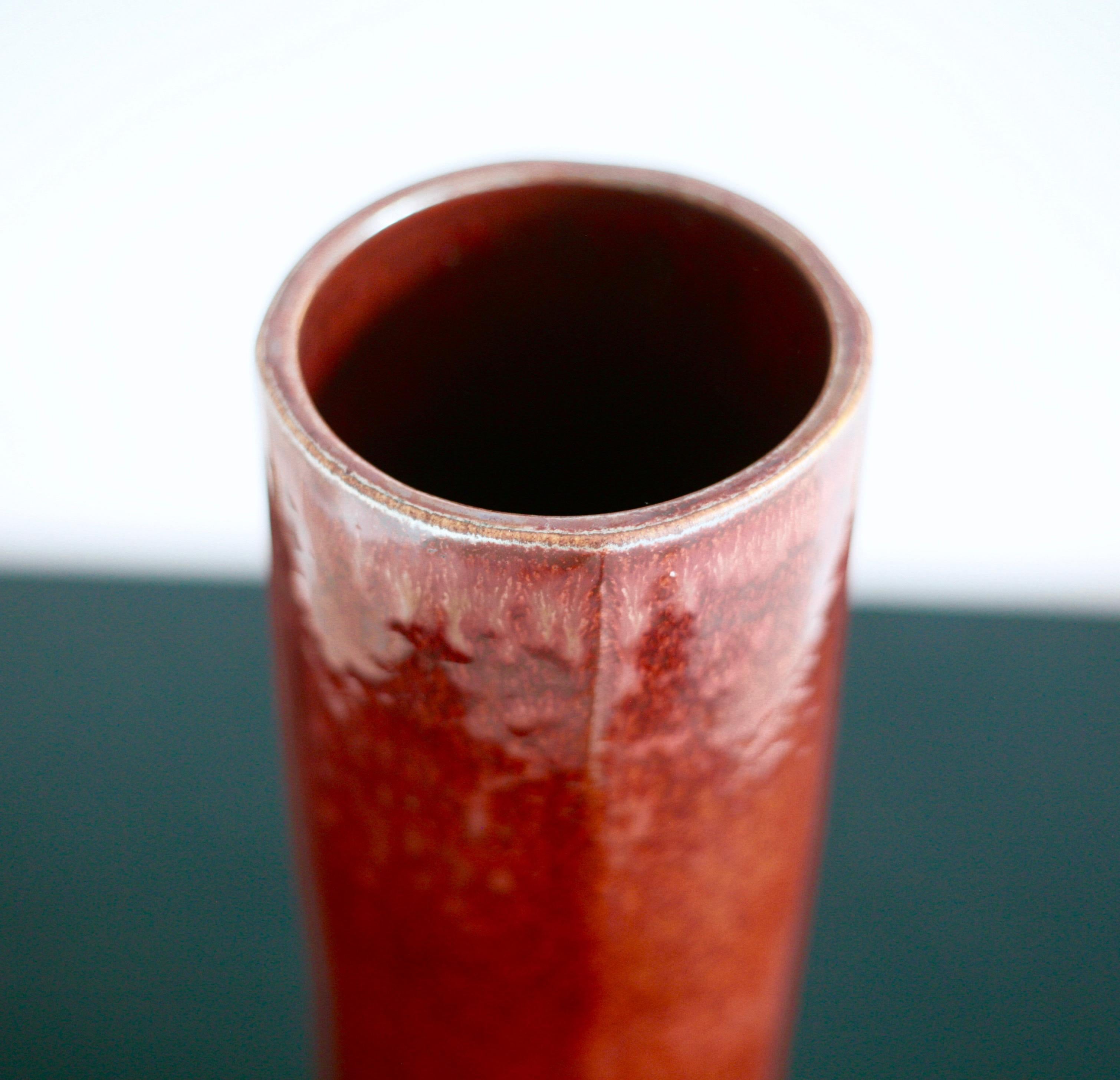 Beautiful stoneware vase designed by Carl-Harry Stålhane för Rörstrand. Deep red glaze. Made in the atelier indicating that the design was selected and made in a limited edition.