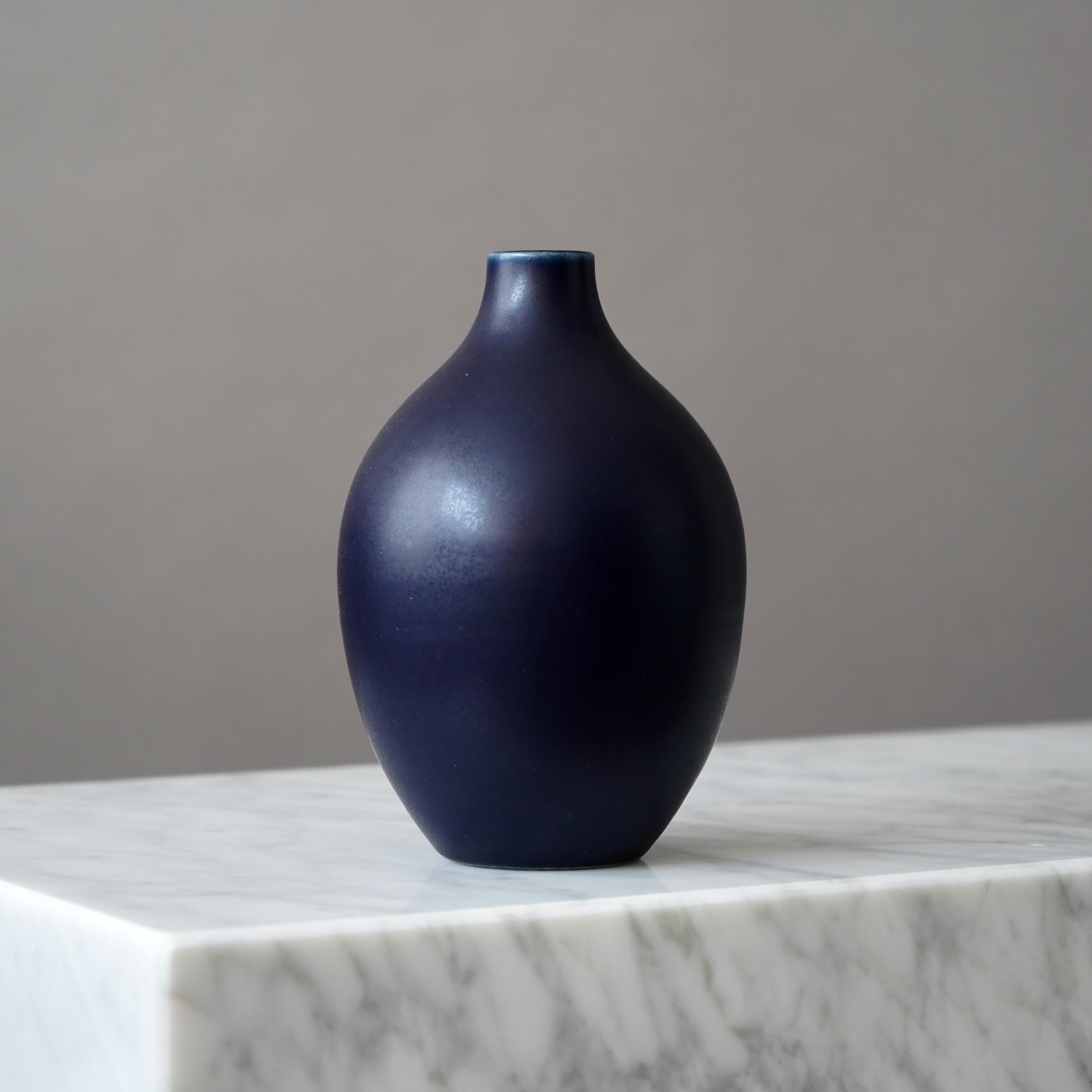 Beautiful stoneware vase made by master ceramists Erich and Ingrid Triller.
This piece was created at their workshop in Tobo, Sweden, 1950’s.

Great condition, with a small white dot in the glaze (pictured). 
Signed on the base with their customary