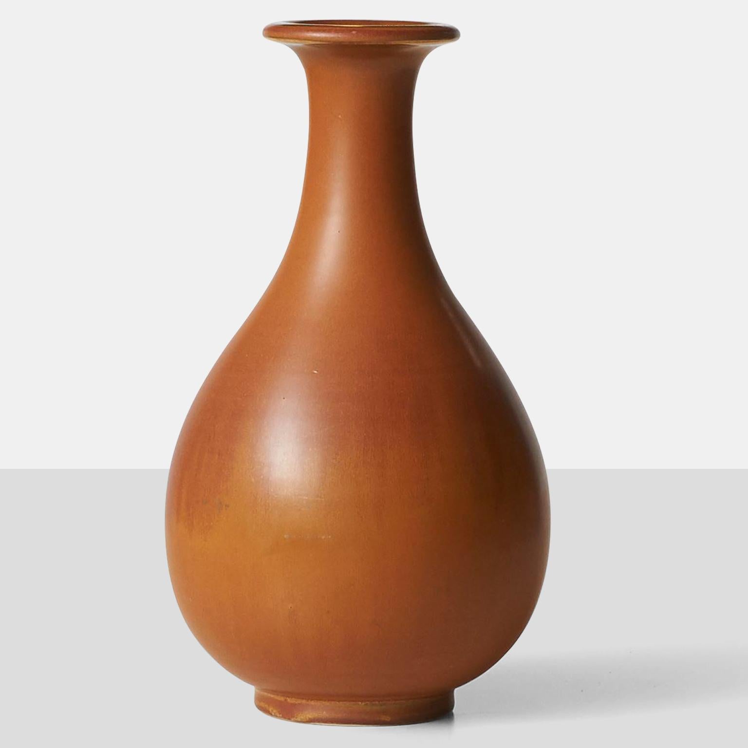 A Gunnar Nylund vase in hare's fur glaze of tans and cinnamon. Crafted by Rörstrand and inscribed {R Sweden GN}.