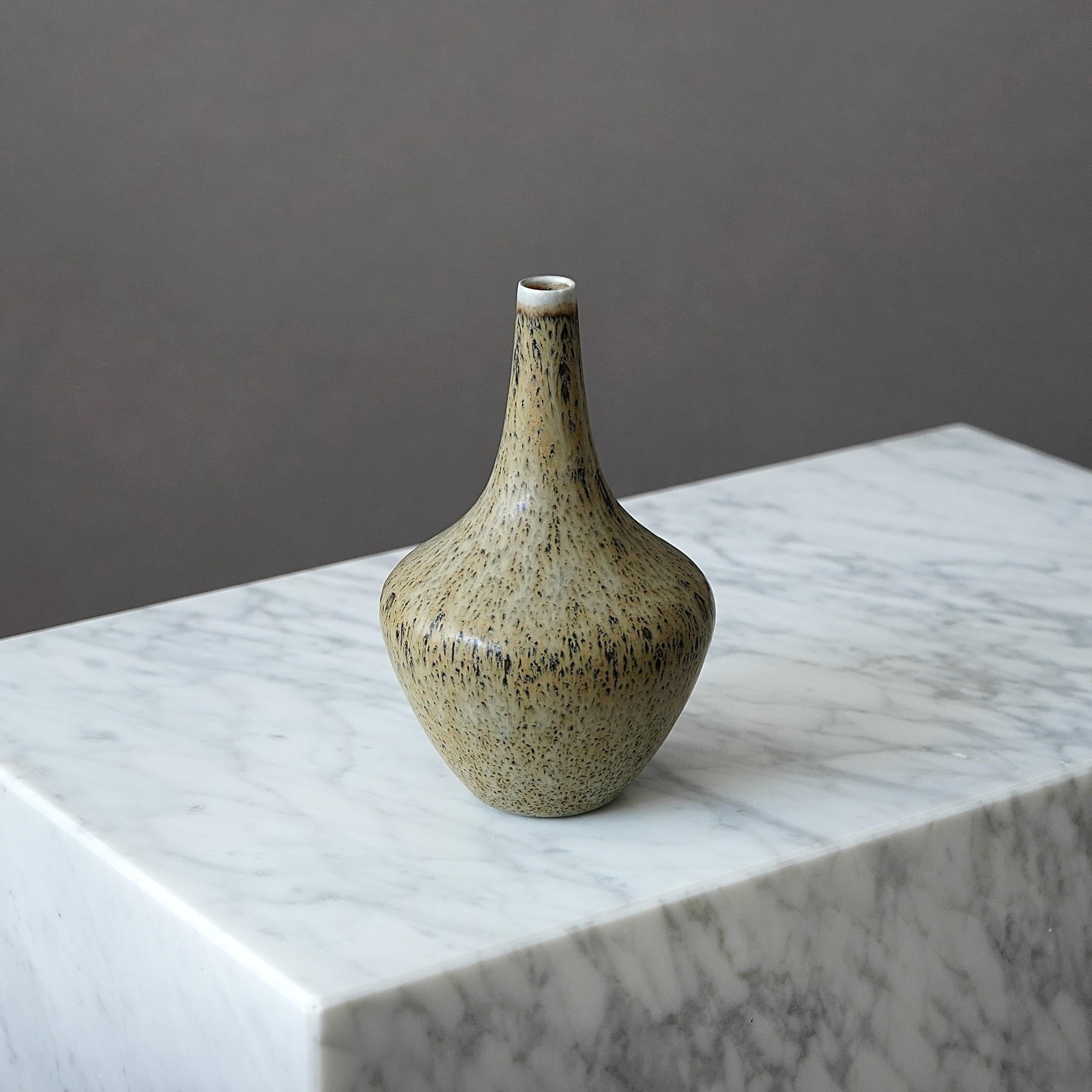 A beautiful stoneware vase with amazing glaze. 
Designed by Gunnar Nylund for Rorstrand, Sweden, 1950s.  

Good condition. Marked as second due to an irregularity in the glaze (from production).
Incised signature 