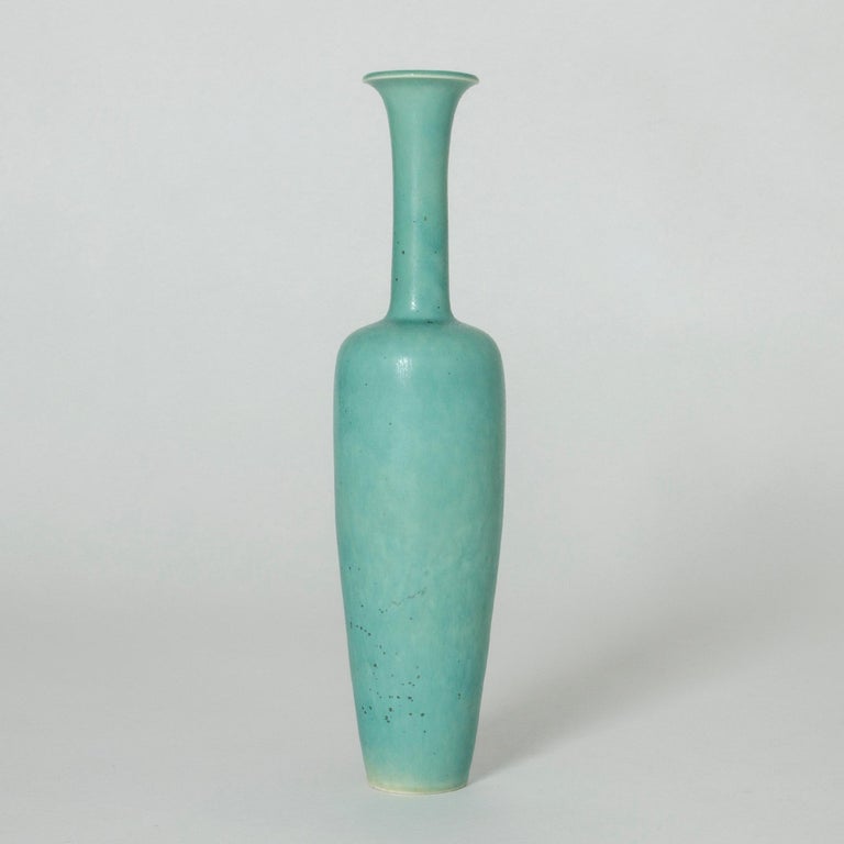 Beautiful stoneware vase by Gunnar Nylund, with an elegant, statuesque shape. Bright ocean green glaze with subtle “Mimosa” flecks.