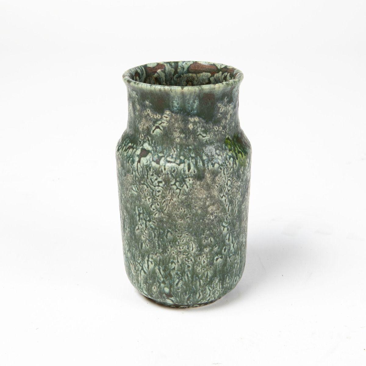 Patrick Nordström (1870–1929).
One of a kind stoneware vase created in Islev in 1928, featuring a beautiful and dynamic glaze in varying green shades. A fine example of Nordström’s mastery of form and glazing techniques.

Signed with monogram, Islev