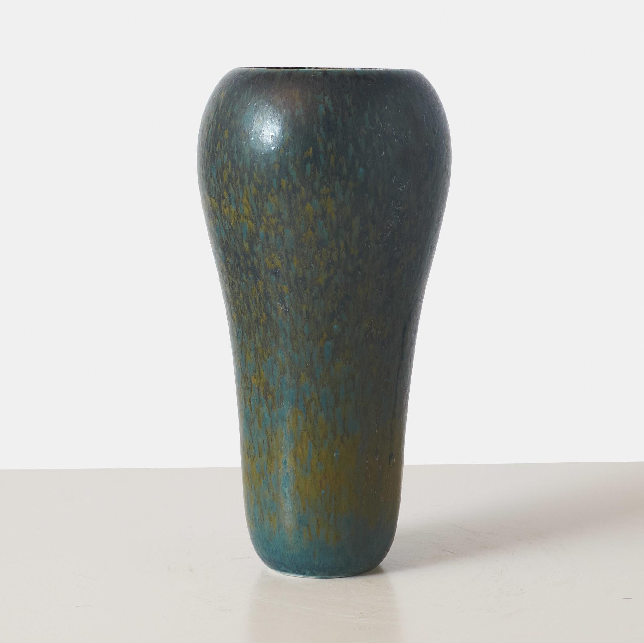 A green and blue mottled stoneware vase. Marked on base with the R monogram, crowns, sweden – 50, E19.