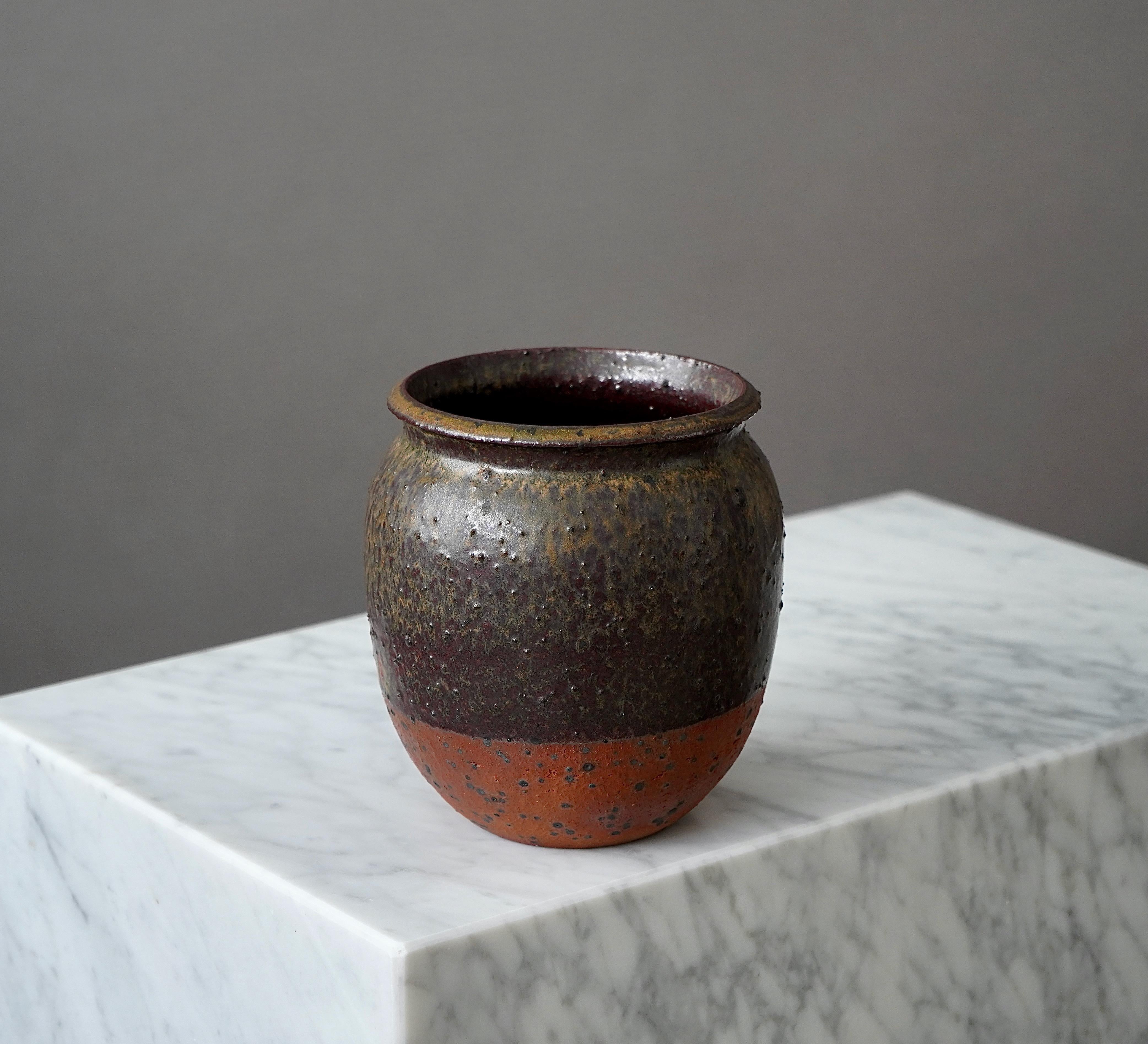 A beautiful and unique stoneware vase with amazing glaze. 
Made by Rolf Palm, in the artist's studio, Mölle, Sweden, 1974.

Great condition. Incised ’Palm / Mölle / G4’.

Rolf Palm (1930–2018) was one of Sweden’s leading ceramic artists in the 20th