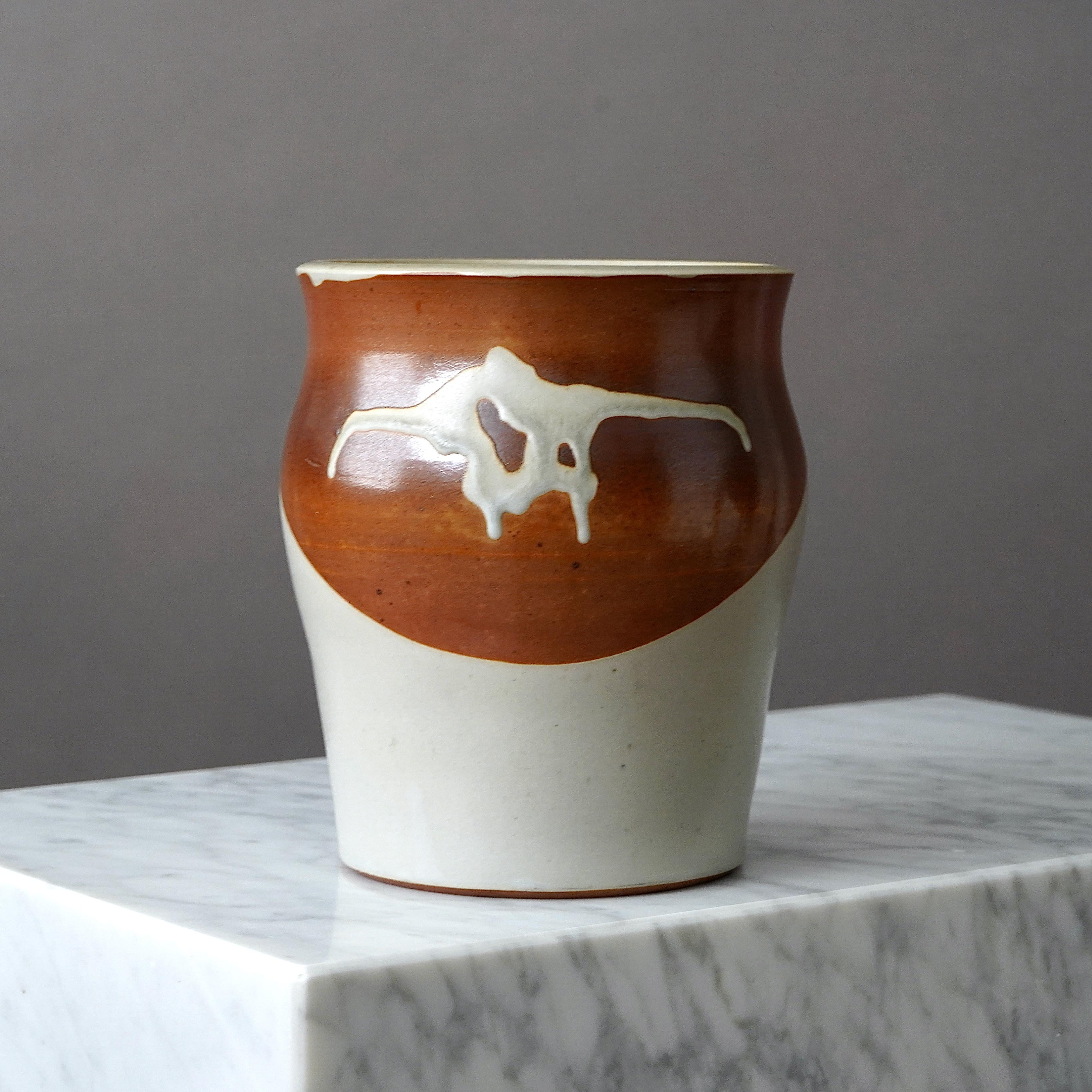A beautiful and unique stoneware vase with amazing glaze. 
Made by Rolf Palm, in the artist's studio, Mölle, Sweden, 1985.

Great condition. Incised ’Palm / Mölle / H5’.

Rolf Palm (1930–2018) was one of Sweden’s leading ceramic artists in the 20th
