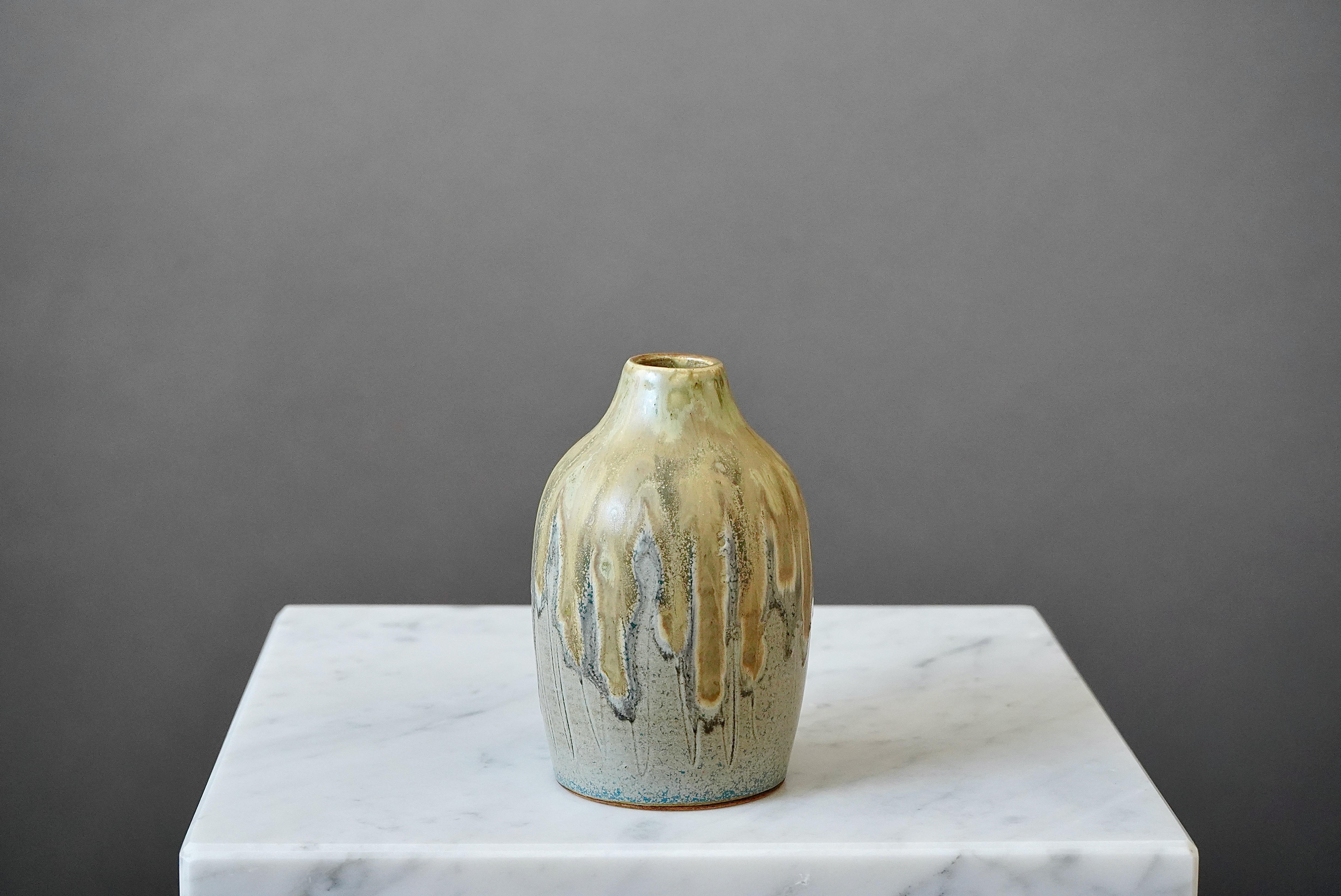 Early and unique stoneware vase with amazing glaze. 
Made by Yngve Blixt, in his studio in Höganäs, Sweden, 1957.

Excellent condition. Incised Yngve Blixt, Höganäs, 1957.

Yngve Blixt (1920–1981) was one of Sweden’s leading ceramic artists in