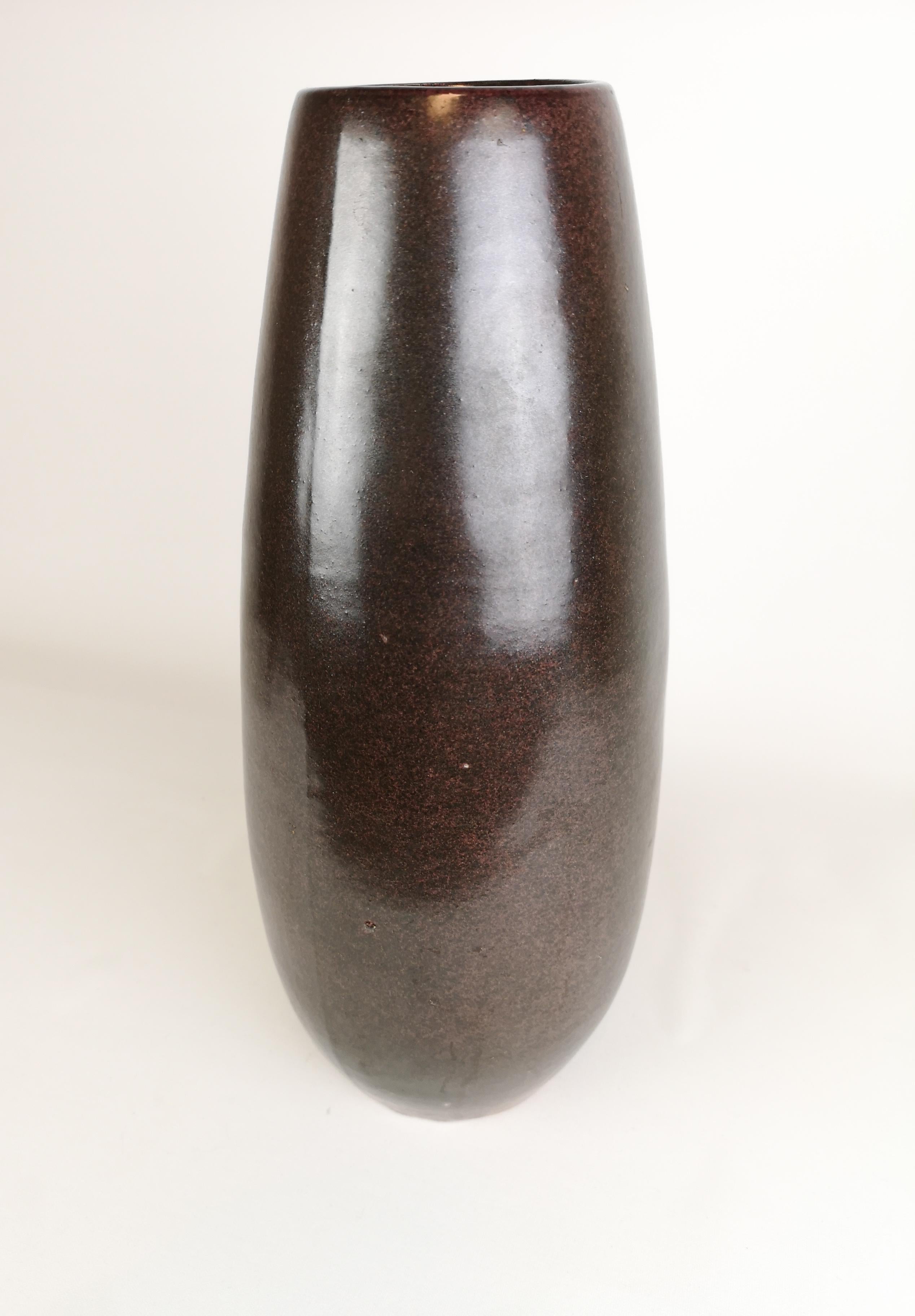 Nice tall vase made in Höganäs Sweden by designer Karl Persson made in the 1970s.


 