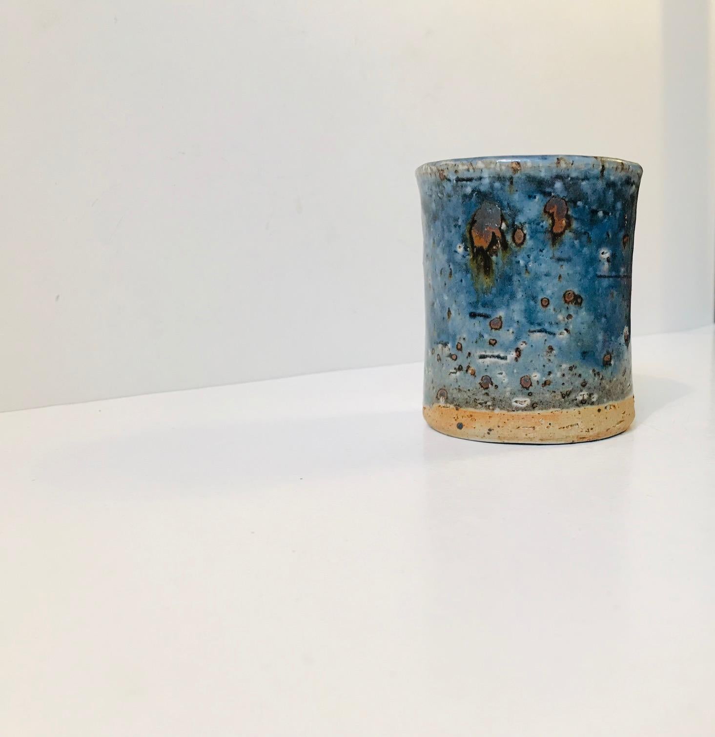 - A limited Atelje studio vase from Rörstrand in Sweden
- Designed by Marianne Westman during the 1960s
- This piece features a thick cylindrical body and blue crystalline glazes
- Signed and marked by hand to the base.