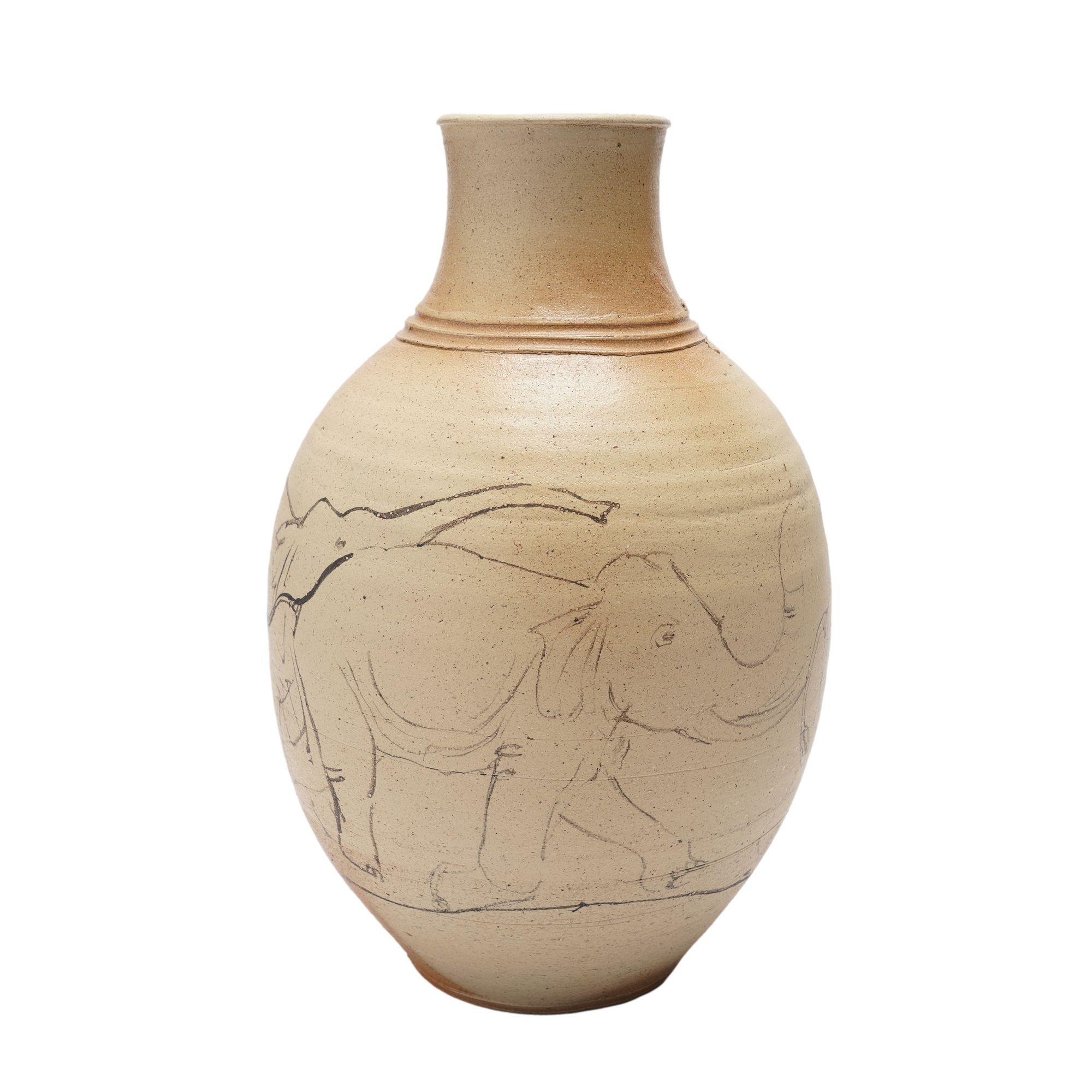 Hand thrown and salt glazed stoneware vase with a continuous memory of elephants sketched around the body of the vessel.

Signed on the underfoot: Howdle

Mineral Point, Wisconsin, 1980's.