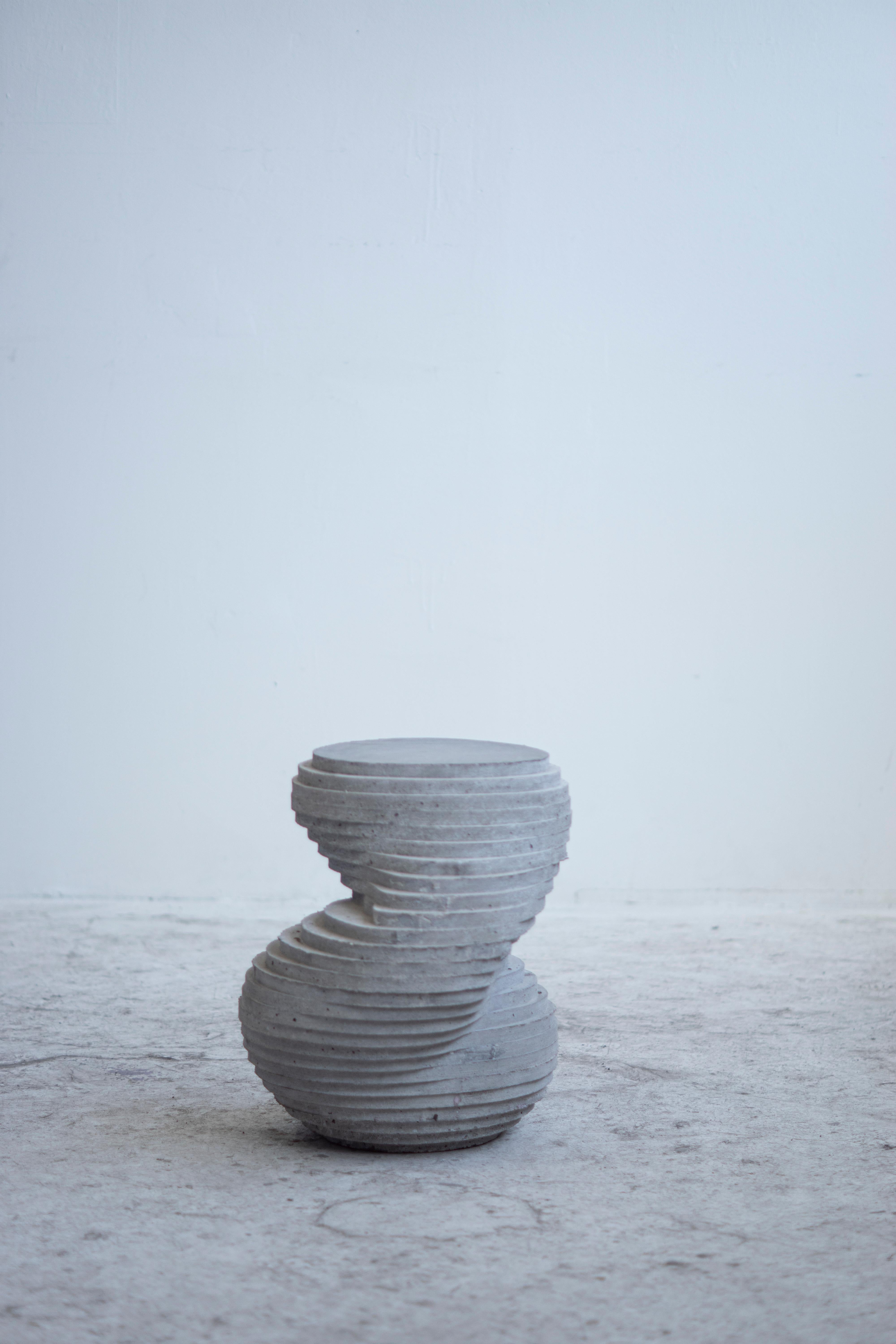 Hand-cast stool that can be used for seating, as a side table or as a sculptural object. For indoor and outdoor use.

At the intersection of art, craft, and design, Concrete Poetics' debut collection of hand-cast cement sculptural furniture and