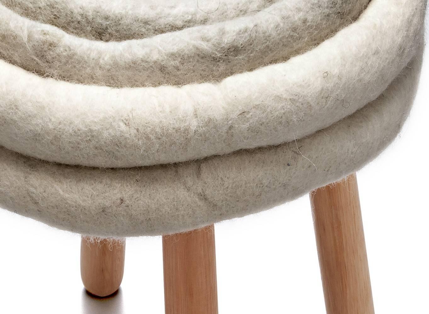 Inês Schertel's stool, in this Brazilian contemporary design, mixes ancient techniques for treating sheep wool with contemporary design and innovation, in order to create unique pieces, full of personality and craftsmanship.