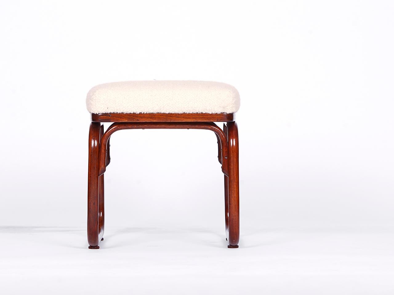 Designed by Josef Frank for Thonet in the 1920s, with paper label. The upholstery consists of a coconut fiber core, covered with a wonderfully soft English boucle cover made of wool. Completely restored.