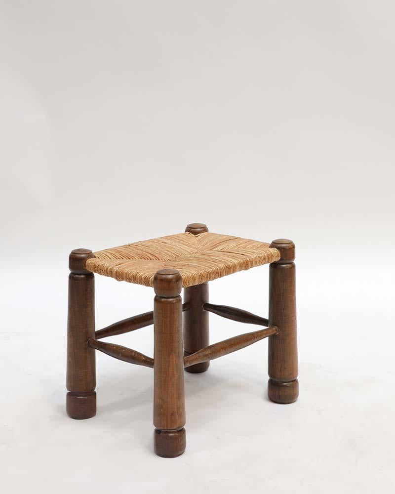 A 1940s French stool by Charles Dudouyt, considered one of his iconic designs. It features his signature carved oak, bold proportions, and sculptural frame — a timeless piece that captures the strength and refinement of his work. 