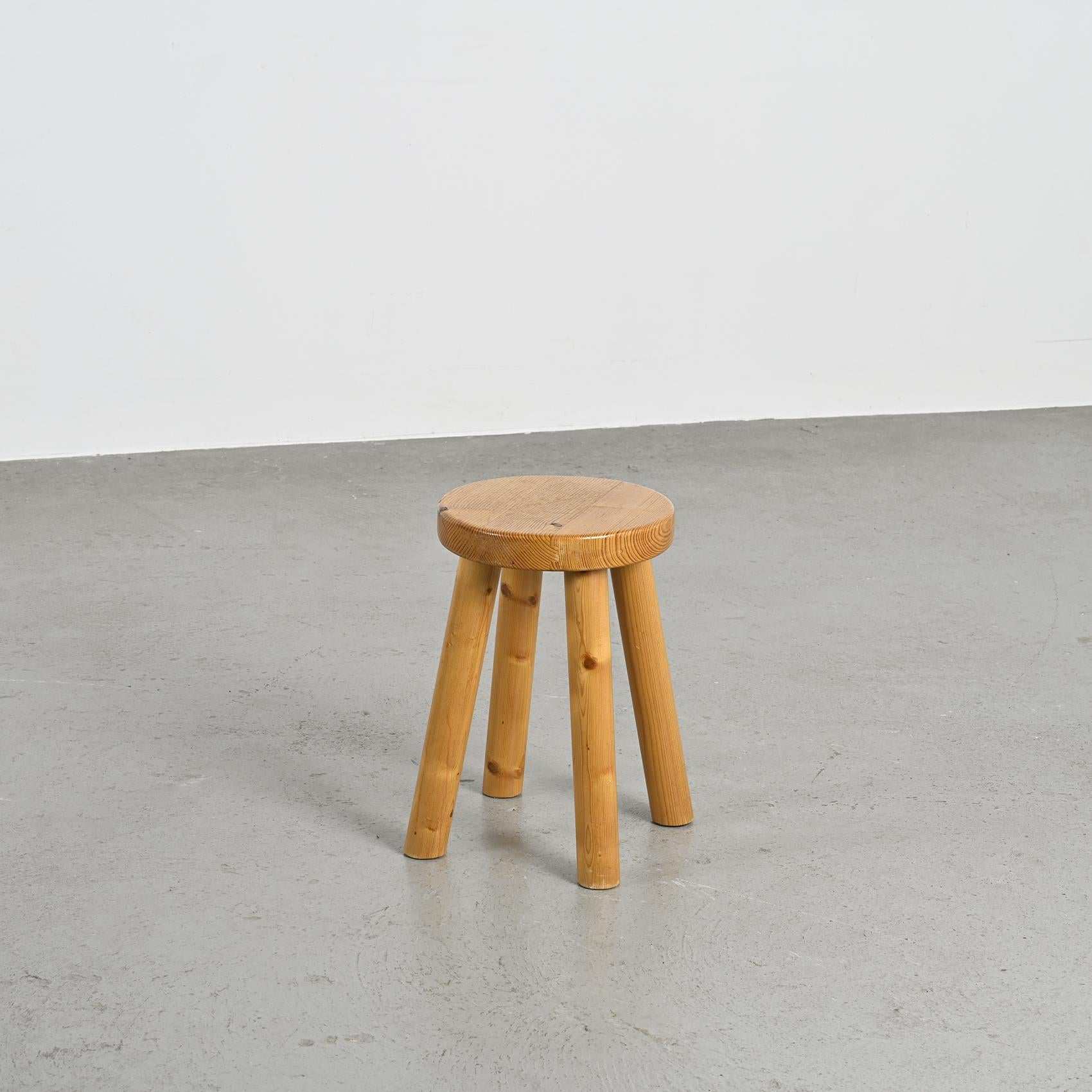 Iconic design by Charlotte Perriand, this stool was conceived in the 1950s to furnish the ski resort of Les Arcs in the French Alps.

This piece is an early edition, directly sourced from the resort.

The pine structure consists of four rounded legs
