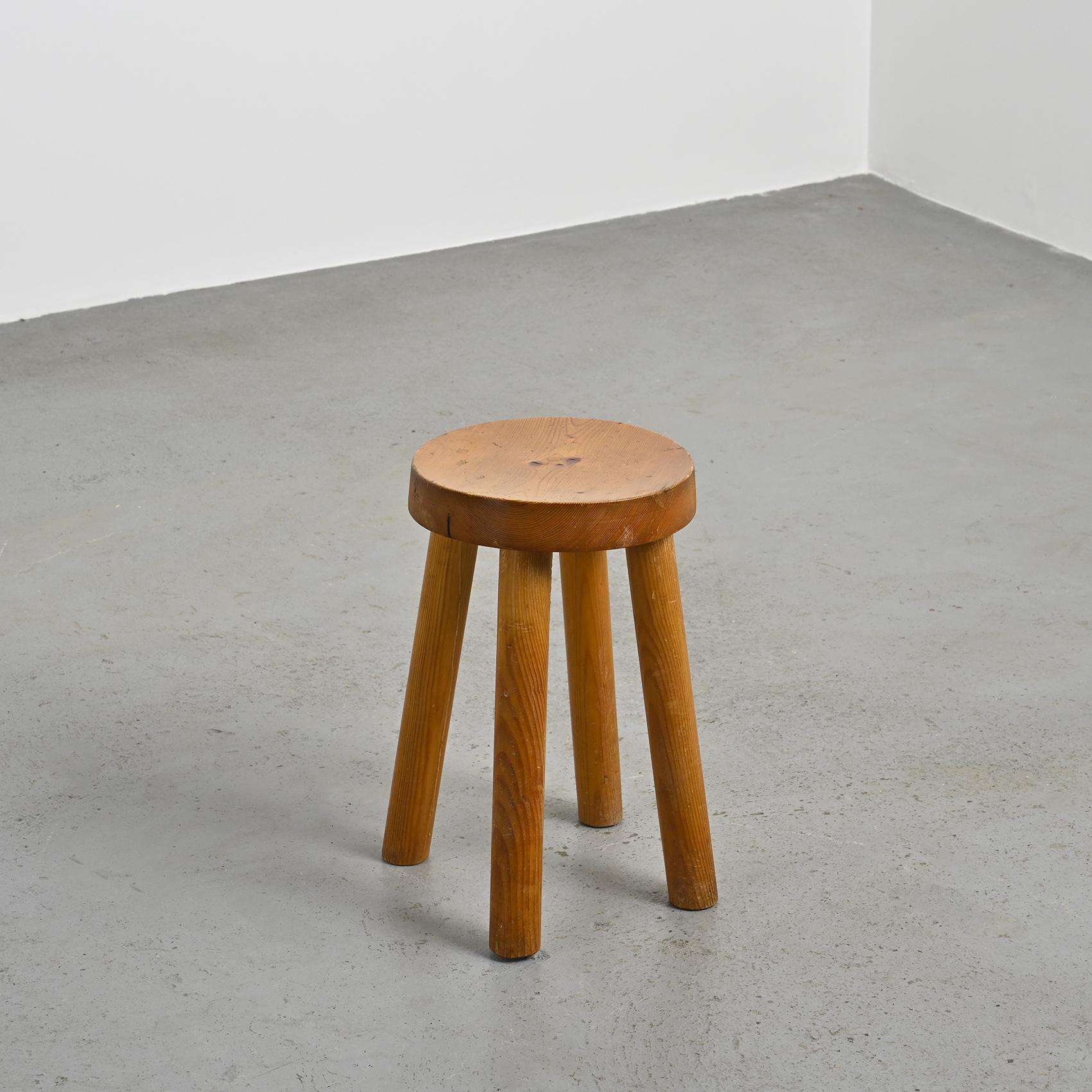 Iconic design by Charlotte Perriand, this stool was conceived in the 1950s to furnish the ski resort of Les Arcs in the French Alps.

This piece is an early edition, directly sourced from the resort.

The pine structure consists of four rounded legs