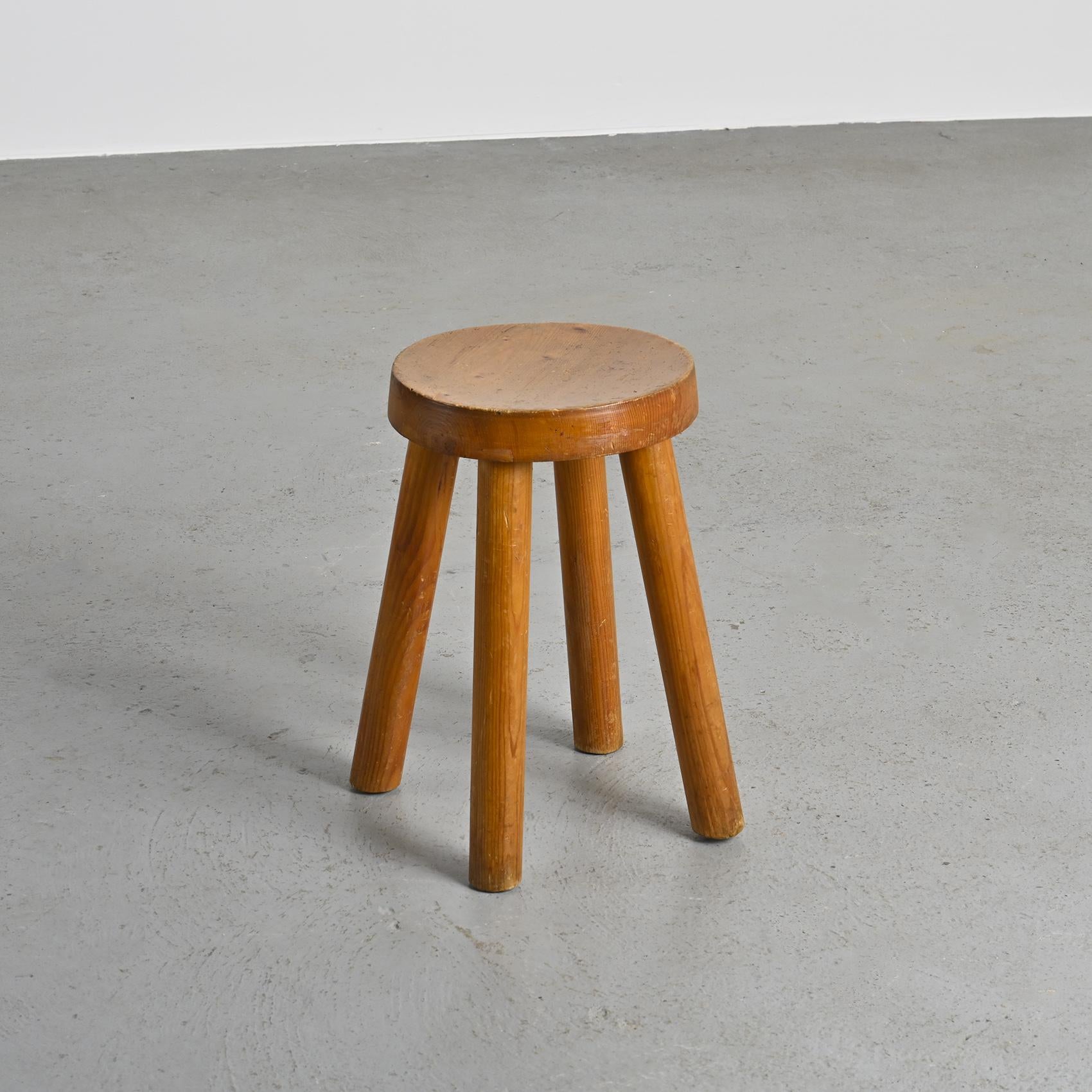 Iconic design by Charlotte Perriand, this stool was conceived in the 1950s to furnish the ski resort of Les Arcs in the French Alps.

This piece is an early edition, directly sourced from the resort.

The pine structure consists of four rounded legs