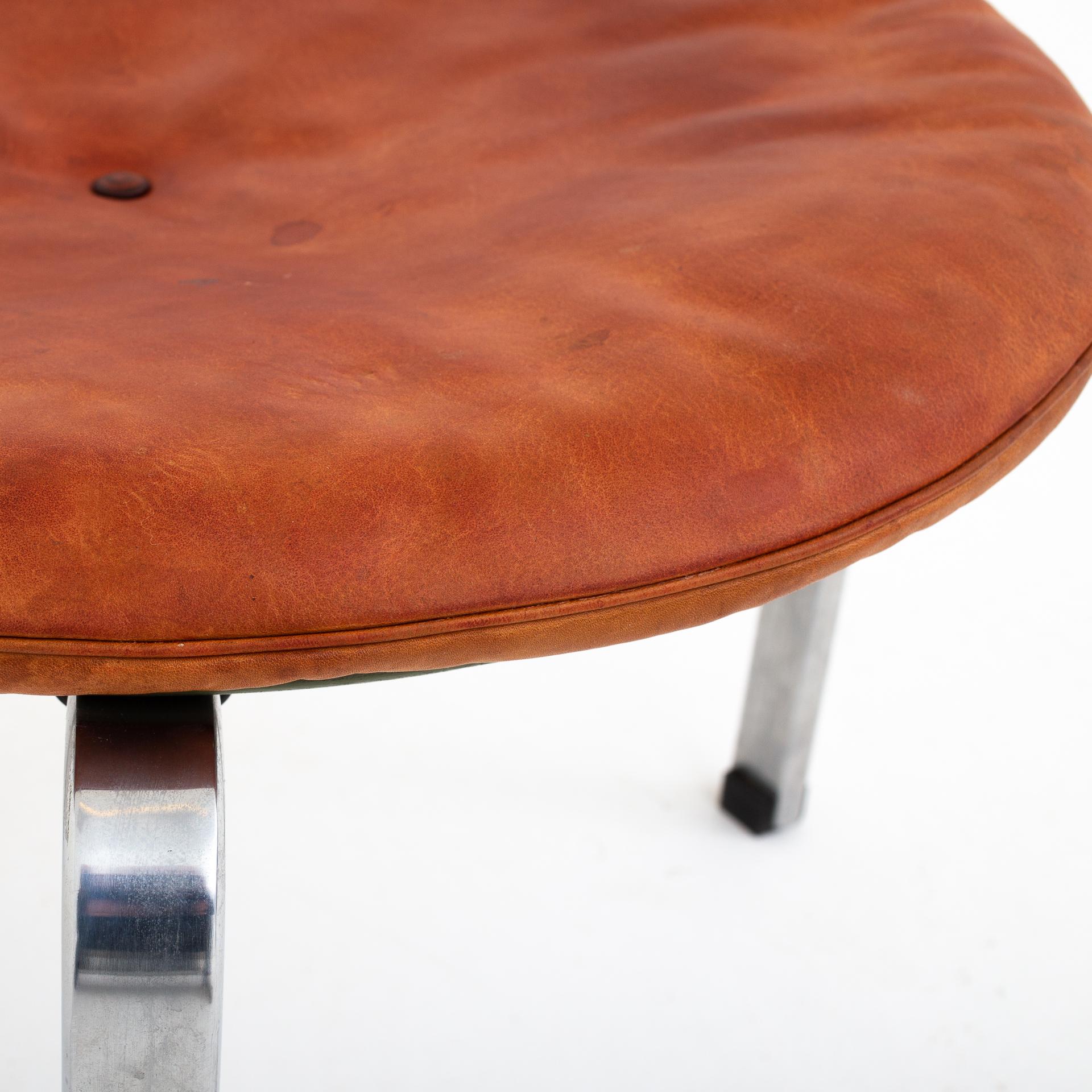 PK 33, stool in patinated natural leather on a matte-chromed steel frame. Designed 1959. Maker E. Kold Christensen.