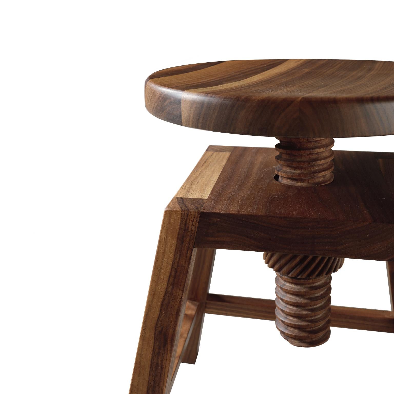 A refined and simple design, where the premium solid walnut in oil finish is used in its maximum expression. The central screw, entirely in wood, is the result of the work of expert Italian craftsmen. A timeless stool with natural and authentic