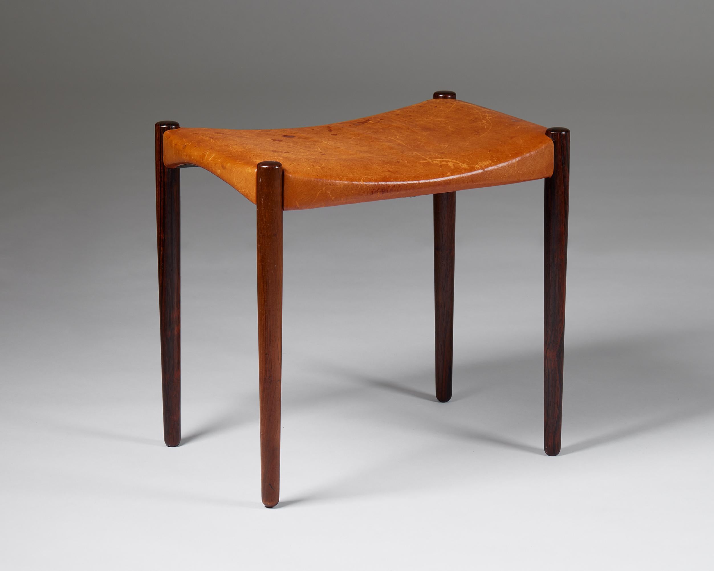 Stool designed by Ejner Larsen and Aksel Bender Madsen for Willy Beck,
Denmark, 1950s.

Brazilian rosewood and leather.

Marked.

Dimensions:
H: 50 cm / 19 3/4''
W: 56 cm / 22''
D: 40 cm / 15 3/4''