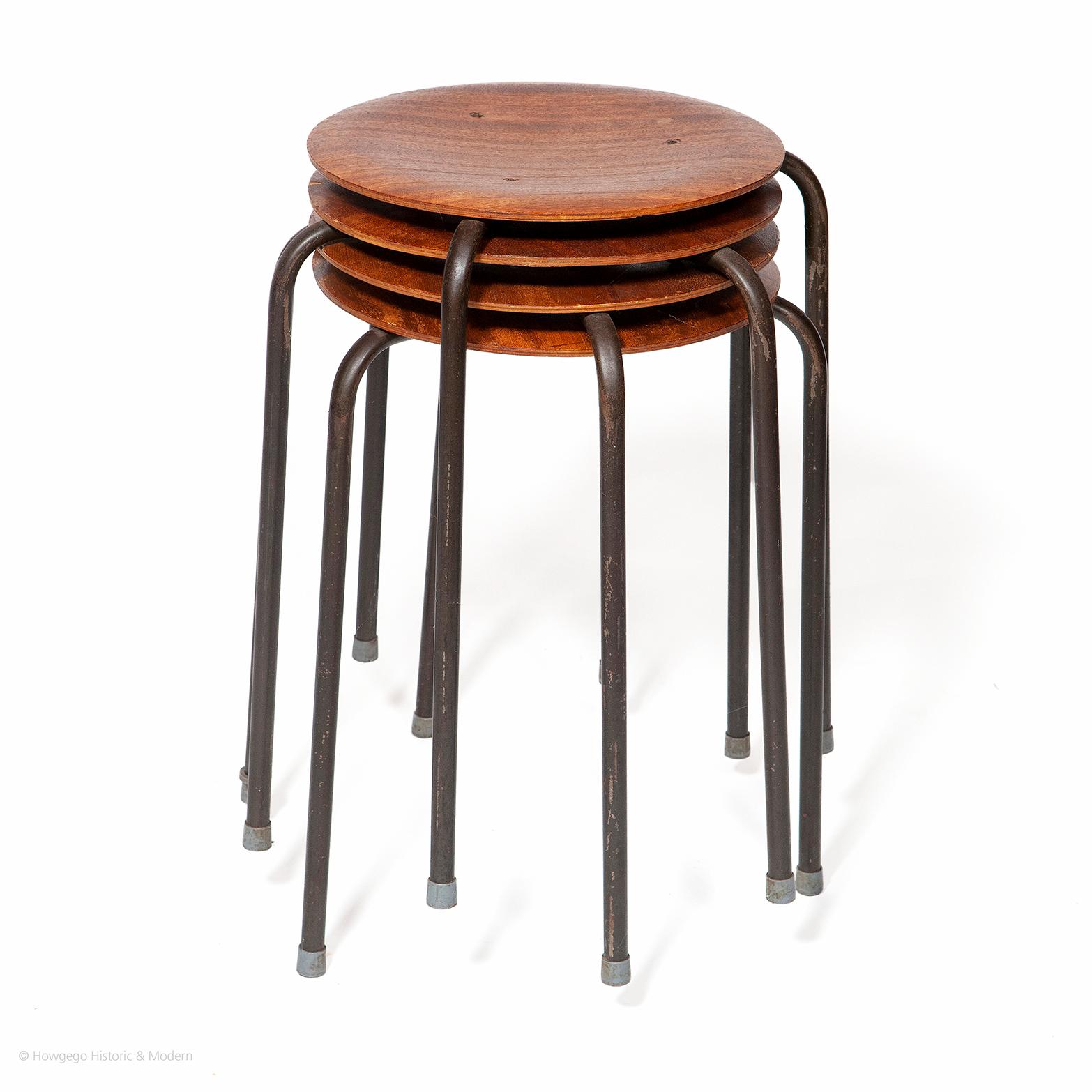 • This set of four, Mid-Century Modern Dot stools is in original condition with teak seats on three chrome legs with the original grey plastic cappings on the feet.
• These dot stools inject classic elegance into an interior and are suitable for