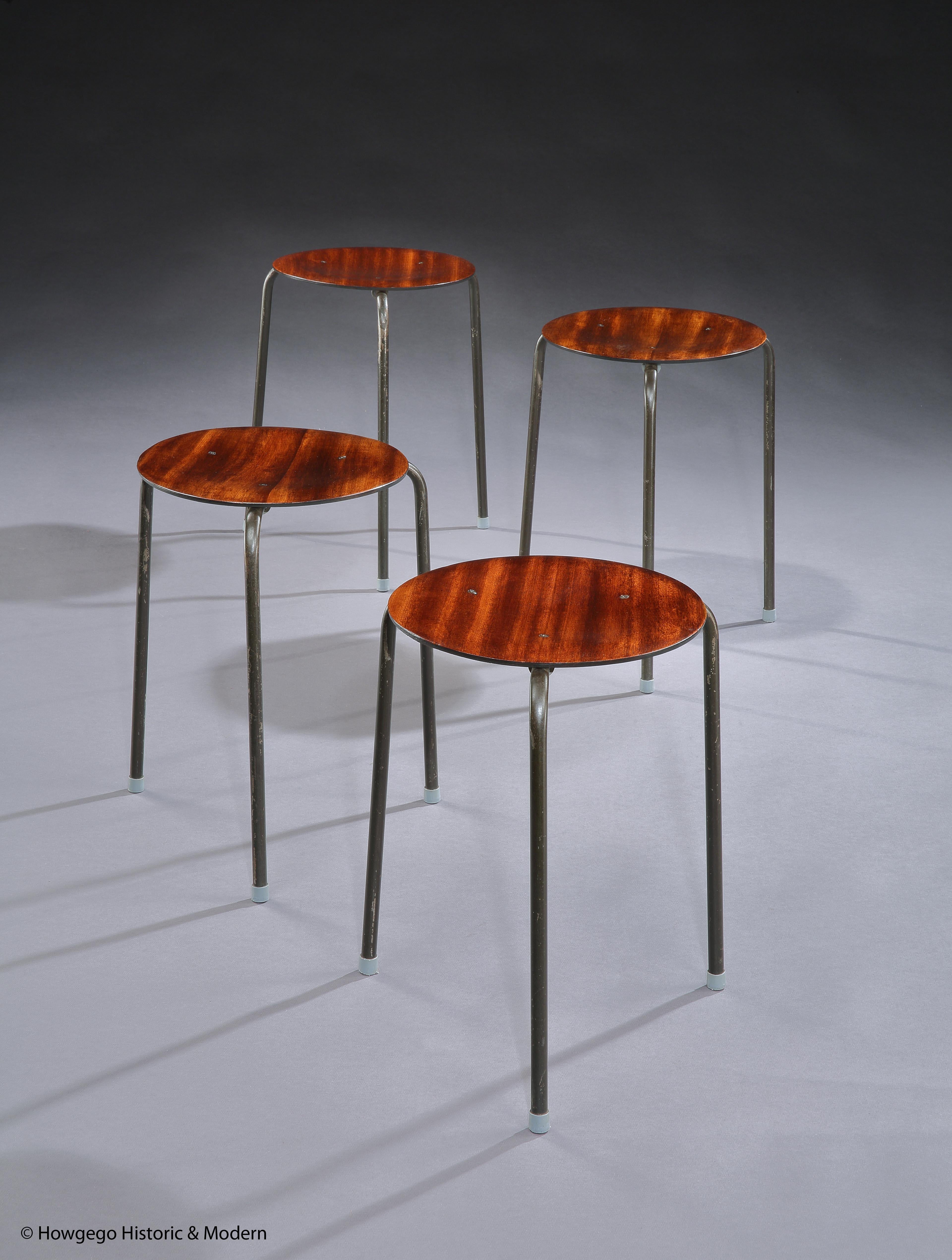 - Exceptional set of four, Mid-Century Modern Dot stools in original condition with teak seats on three chrome legs with the original grey plastic cappings on the feet.
- These dot stools inject Classic elegance into an interior and are suitable for