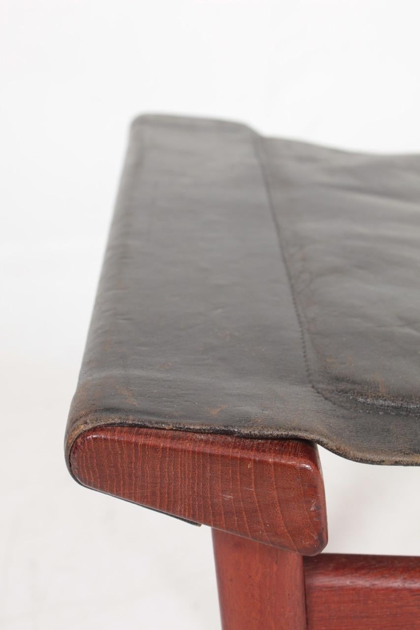 Stool in patinated leather, designed by Ejner Larsen & Aksel Bender Madsen, made by cabinetmaker Pontoppidan.