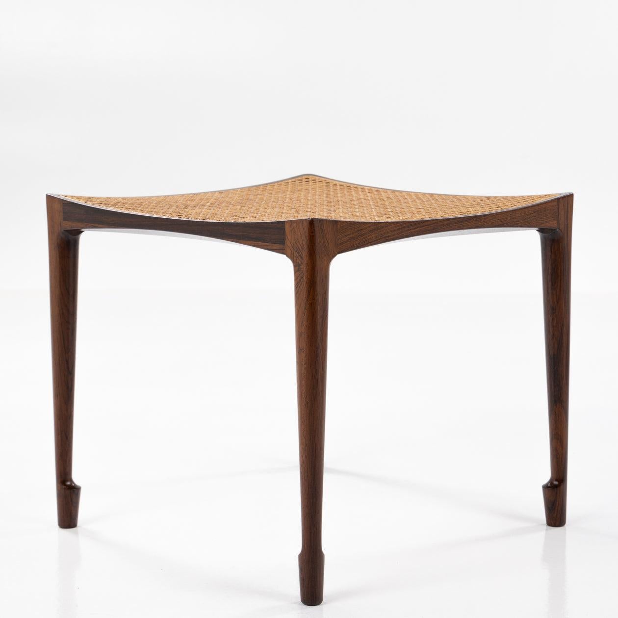 Stool with Rio rosewood frame, slightly curved seat with French wicker and tapered legs. Designed in 1958.
Manufactered by Wørts Møbelsnedkeri.