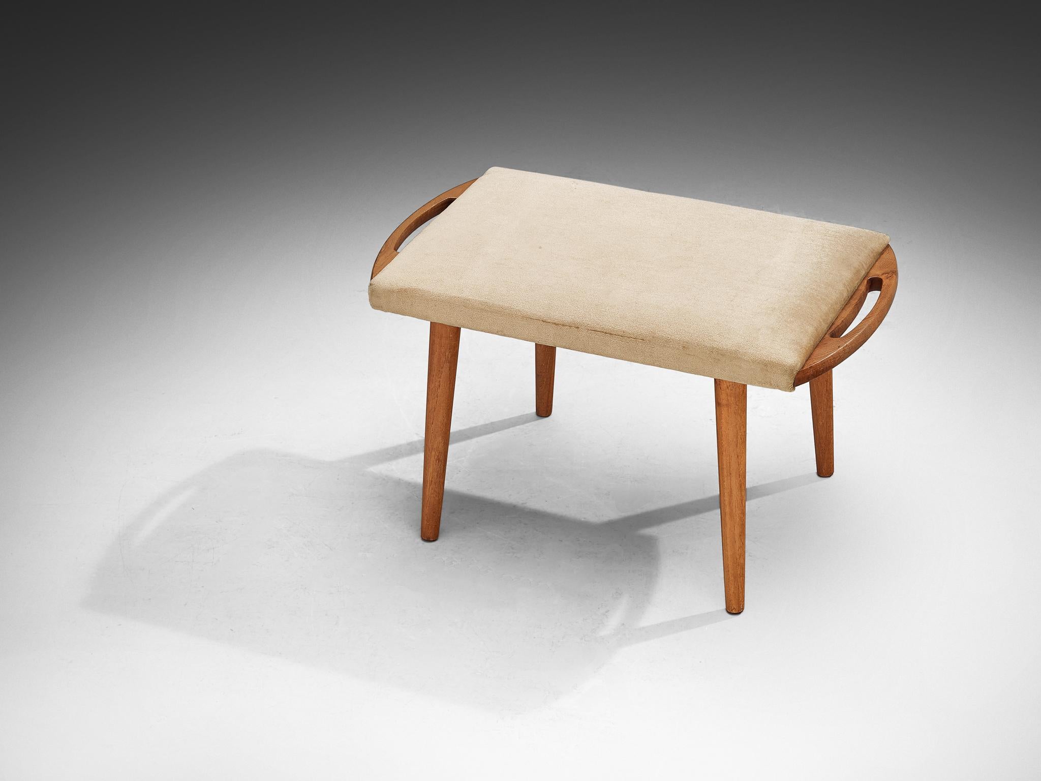 Ottoman, teak, wood, fabric, Europe, 1950s

Simple in its design, this stool features an open framework in teak with tapered legs. Its unassuming design allows it to blend seamlessly with various decorative styles, which is a characteristic that