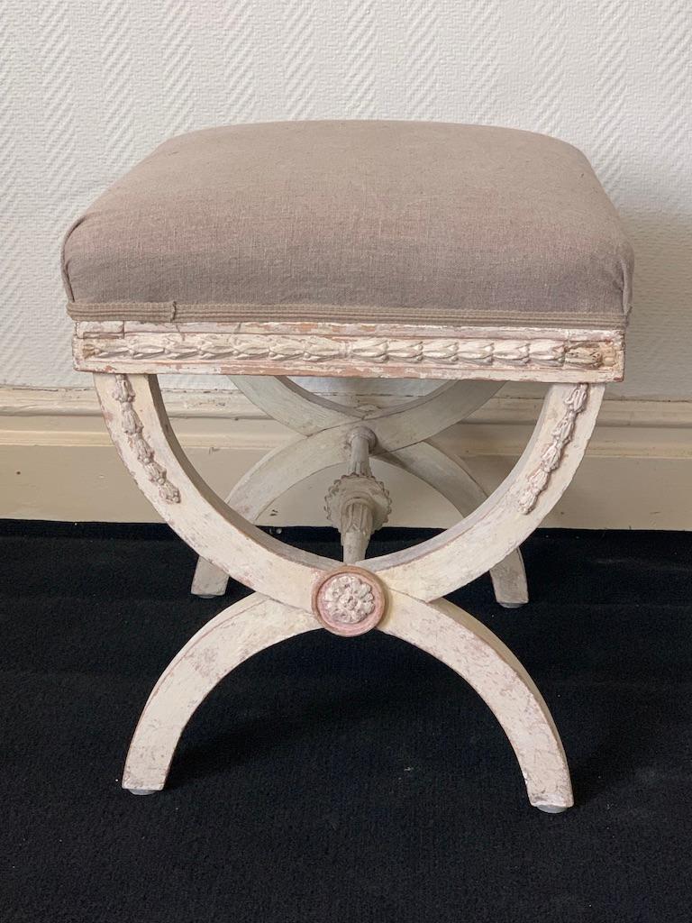 A Gustavian stool made in Stockholm about 1790. The stool is hand crafted with an elegantly leaf shaped border. The stool has fine originally paint with much of indigenous textures remains.

Gustavian style was the leading style in Swedish