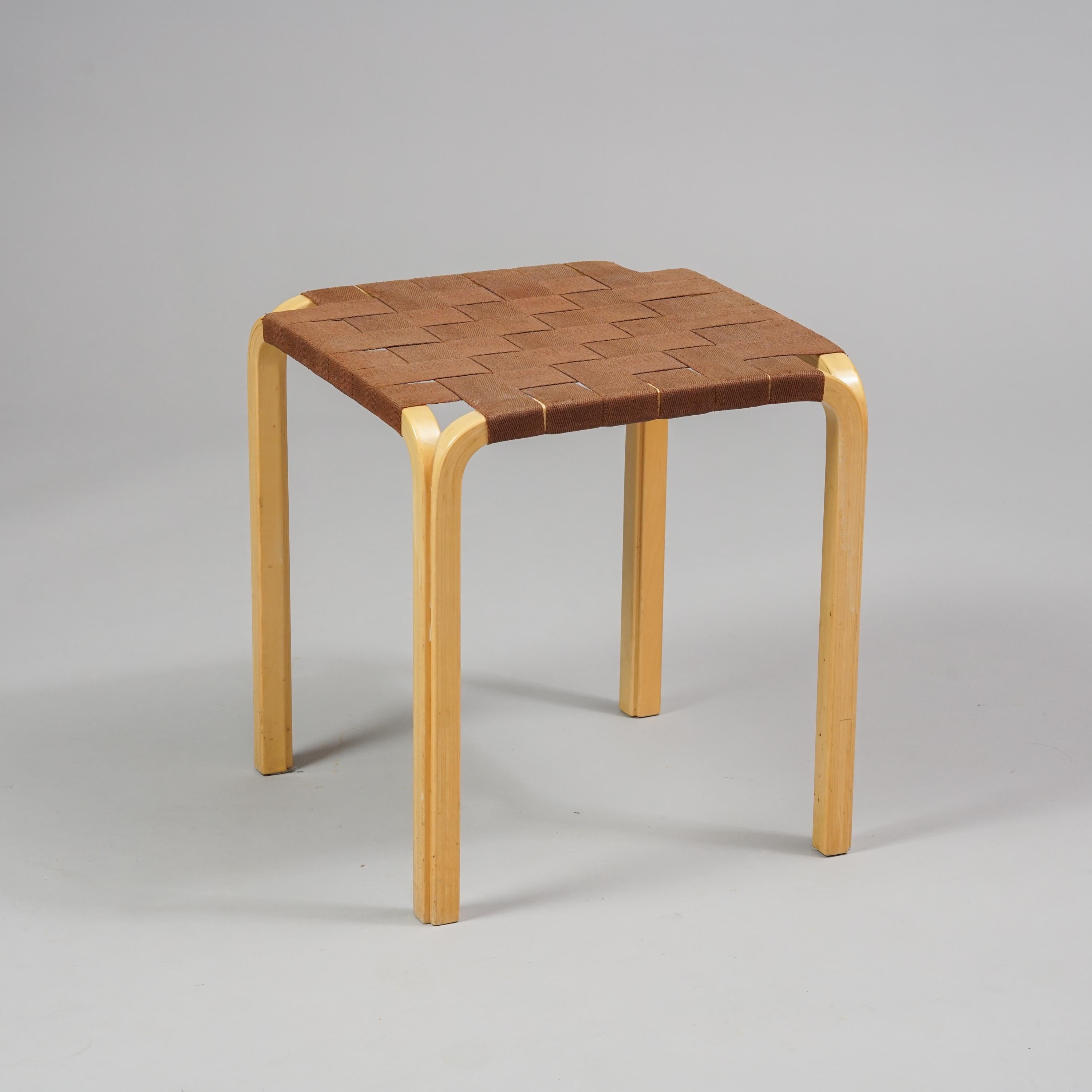 Alvar Aalto model Y 61 stool. Manufactured by Artek in the 1970s / 1980s. The stools have the iconic birch Y -leg design with brown linen webbing. The stool is in good vintage condition, minor wear consistent with age and use. 

The leg