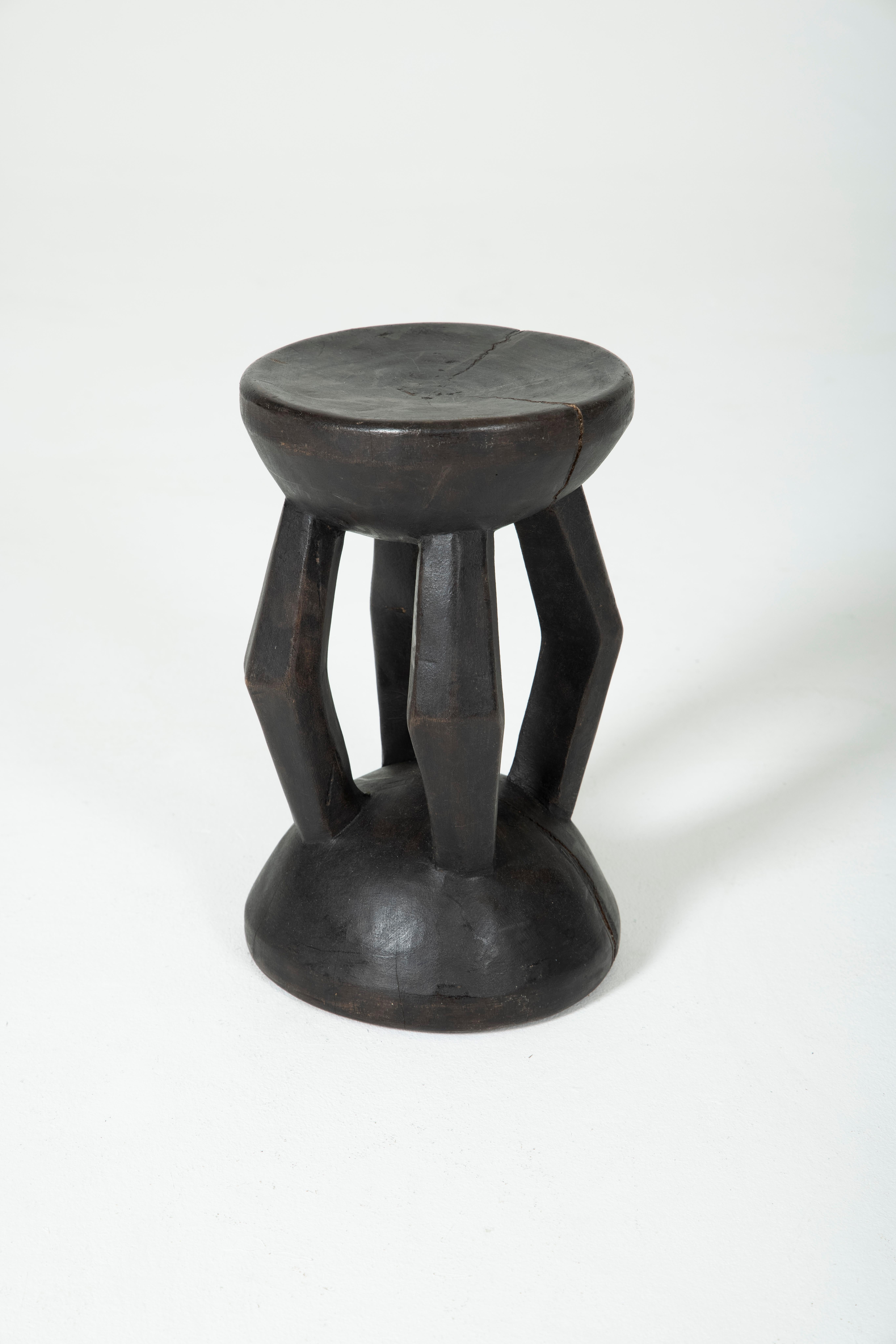 Dogon stool in exotic wood. Stool cut from one piece of wood. Beautiful patina of wood. Very good condition.
