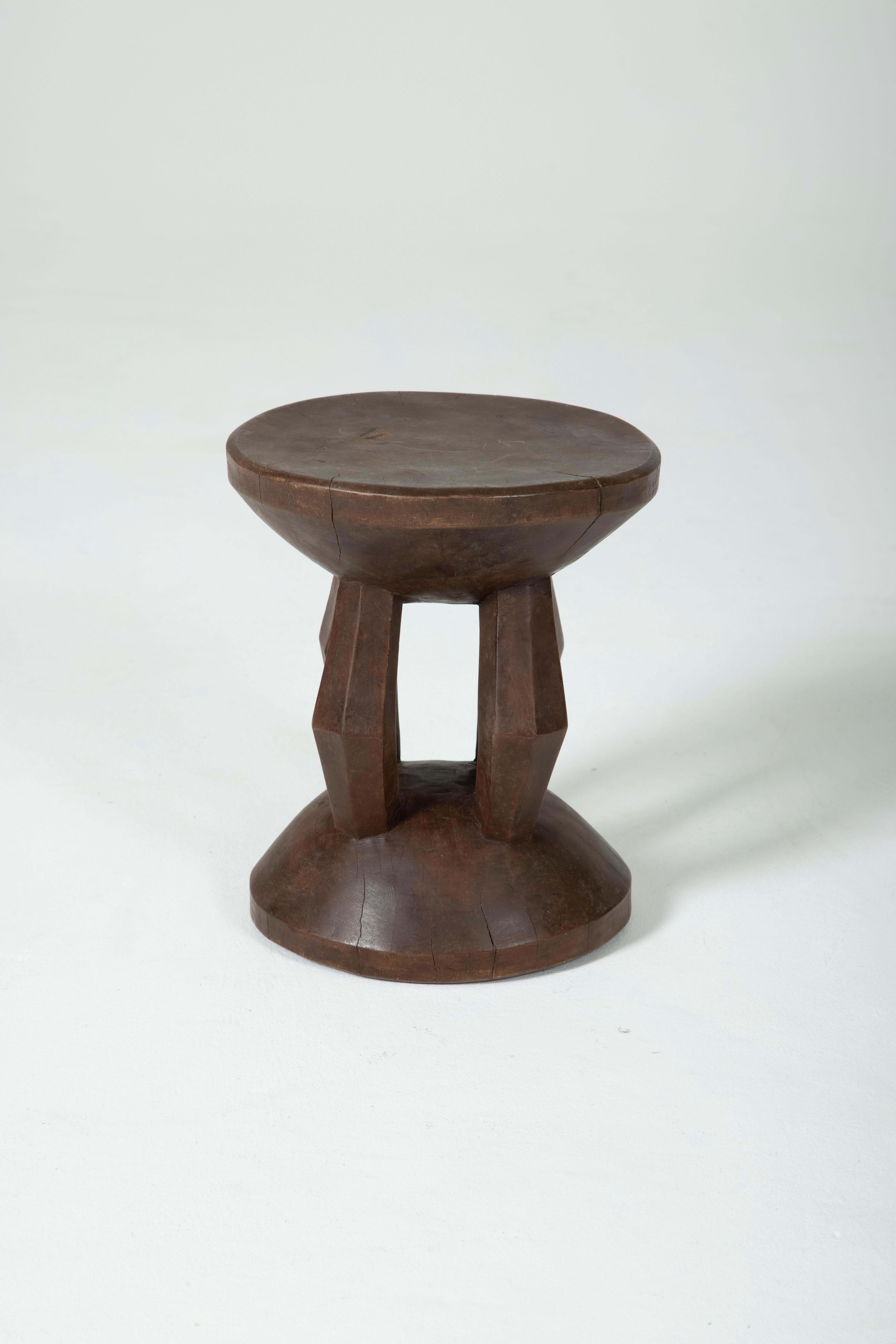 Dogon stool in exotic wood. Stool cut from one piece of wood. Beautiful patina of wood. Very good condition.