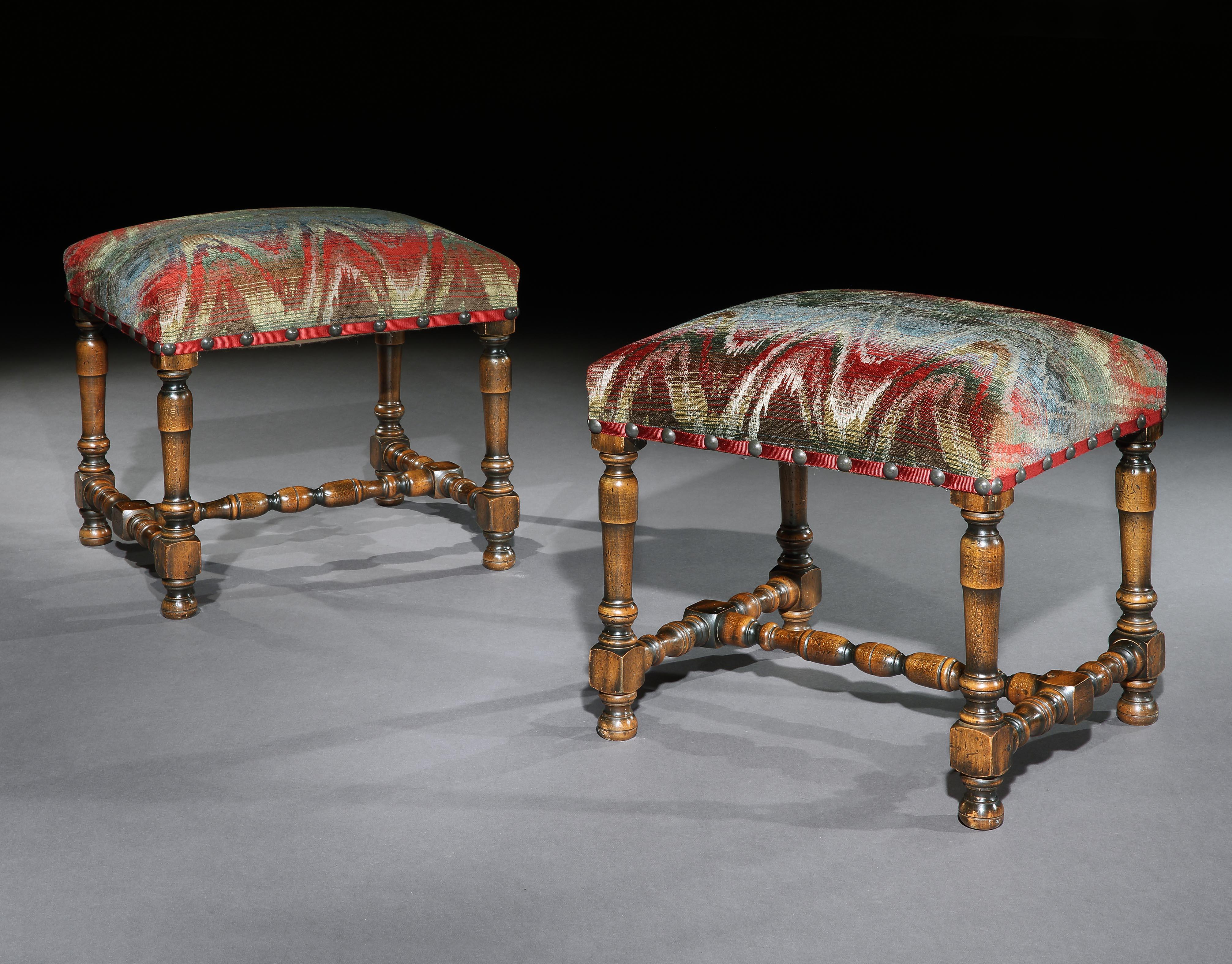 A pair of antiquarian, Baroque-style, walnut, stools upholstered in bargello or flame stitch

In the late 19th-early 20th century the revival of the Baroque-style in country house interiors and furnishing led to exclusive central, London firms