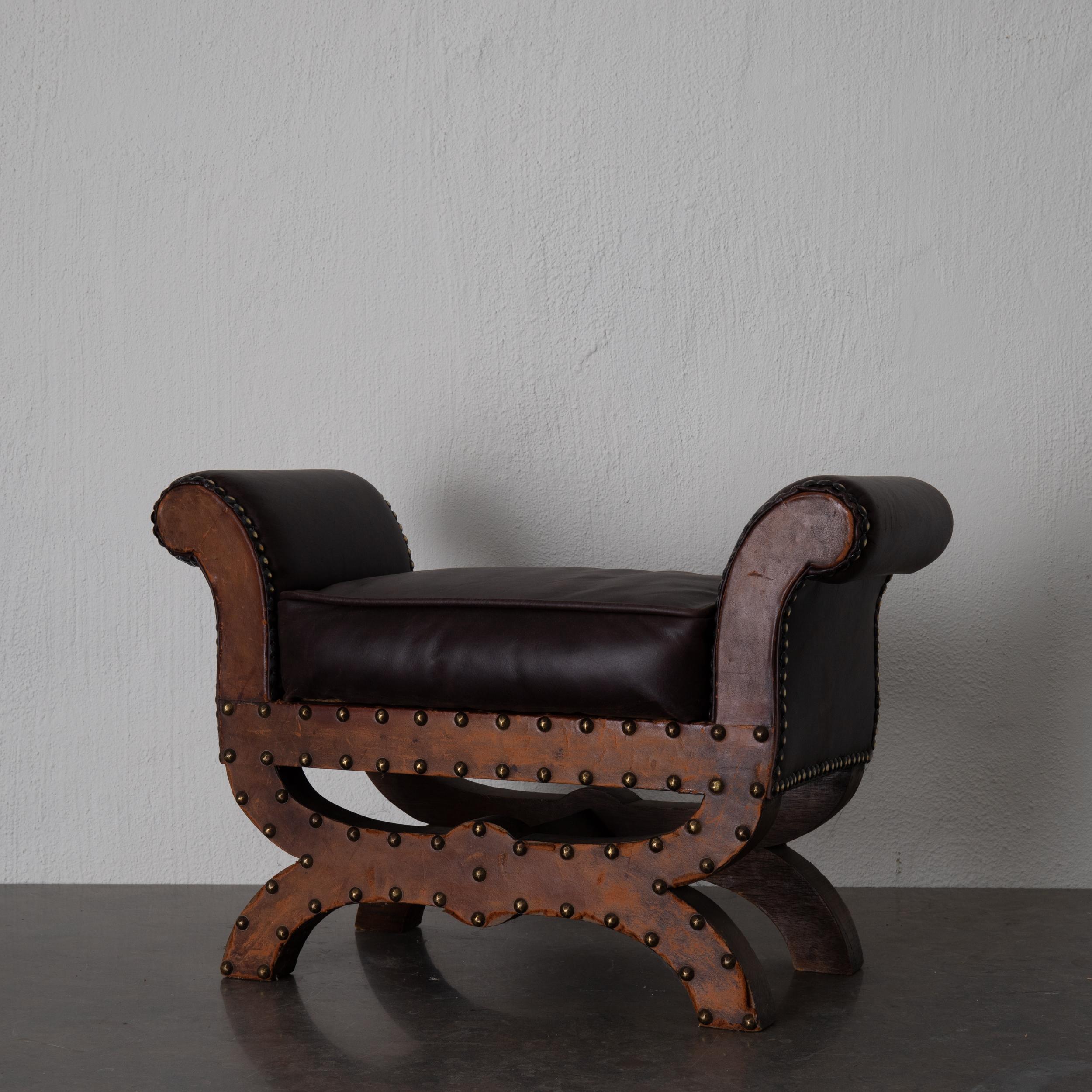 Stool small Otto Schultz Swedish leather Sweden. A stool smaller size made in Sweden during the early 20th century by furniture maker Otto Schultz. Upholstered in a dark brown leather with nail heads.