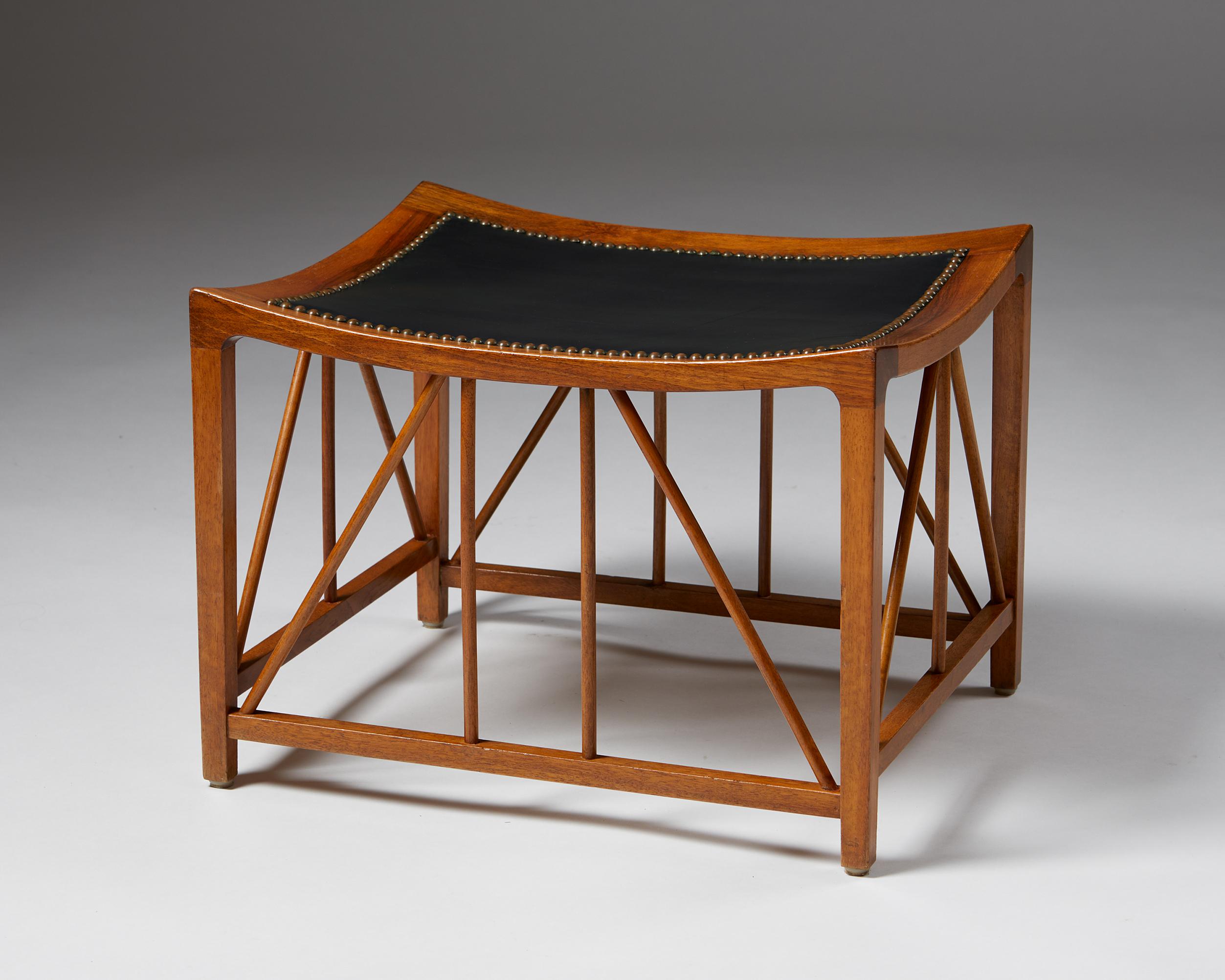 Walnut, and leather upholstery with brass nailing.

Svenskt Tenn model number 1063.

The model 1063 Tutankhamun stool was designed by Josef Frank for Svenskt Tenn in 1941 and is based on a design found in Tutankhamun’s tomb, which was discovered