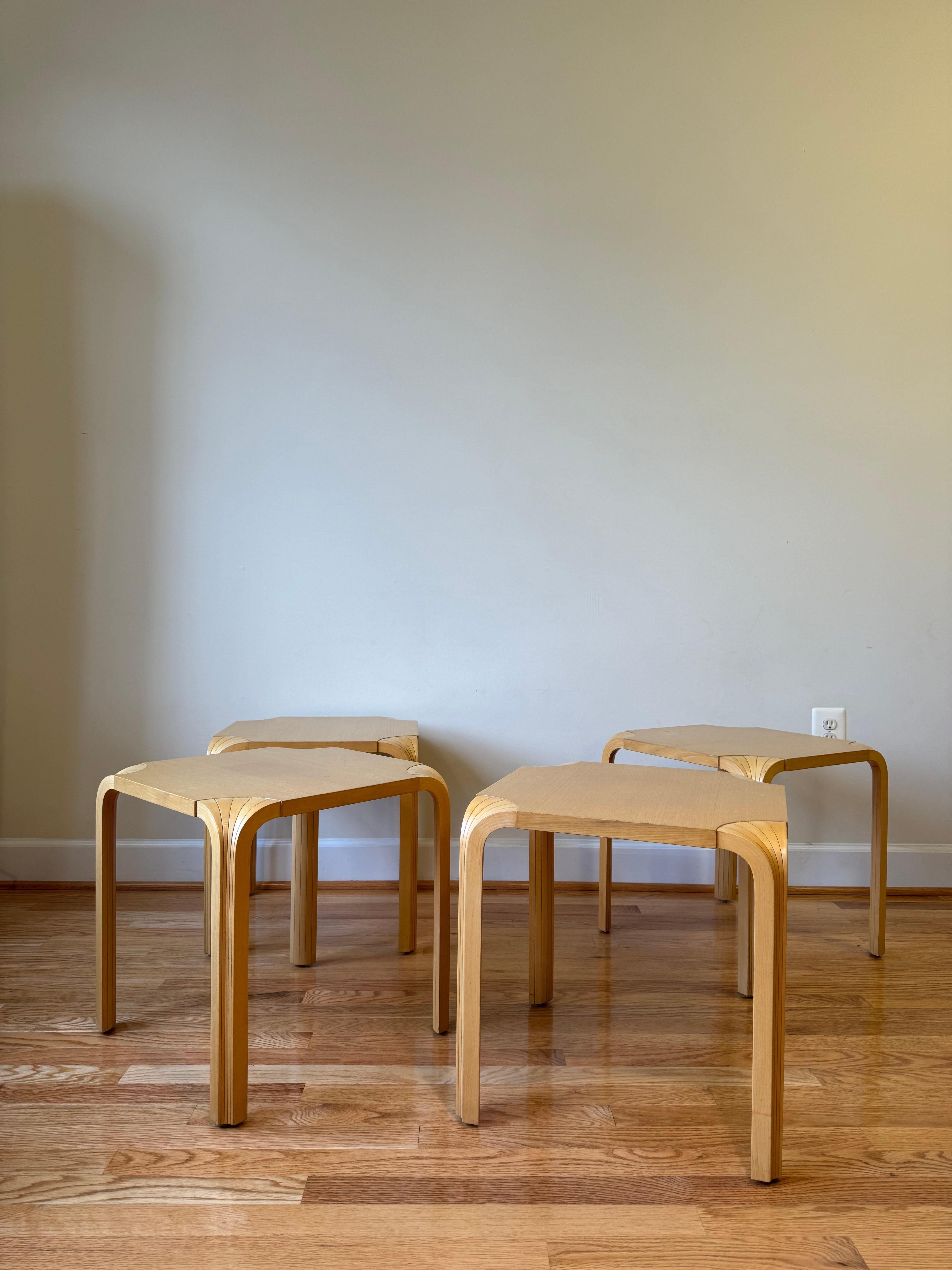 This stool was designed by Alvar Aalto in 1954 and features his impressive X-Leg design. 
X-Legs are created from splitting the traditional L-Leg in a longitudinal direction and re-connecting the pieces to create an intricate fan-like design. 
Aalto