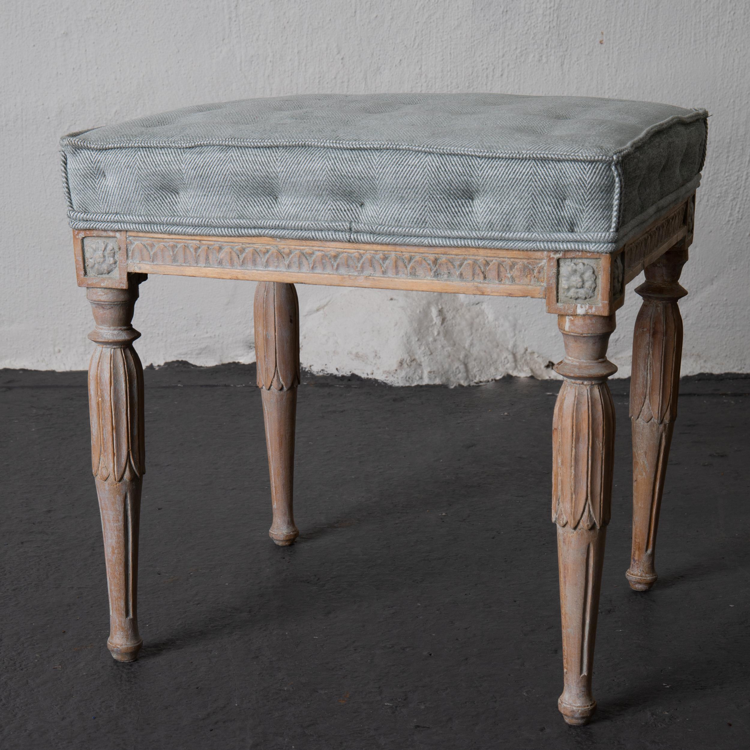 Stools assembled pair of Swedish Gustavian neoclassical wood, Sweden. An assembled pair of stools made during the Gustavian period in Sweden. Leaf tip carvings on frieze and legs. Upholstered in a soft fishbone patterned fabric in green and white.