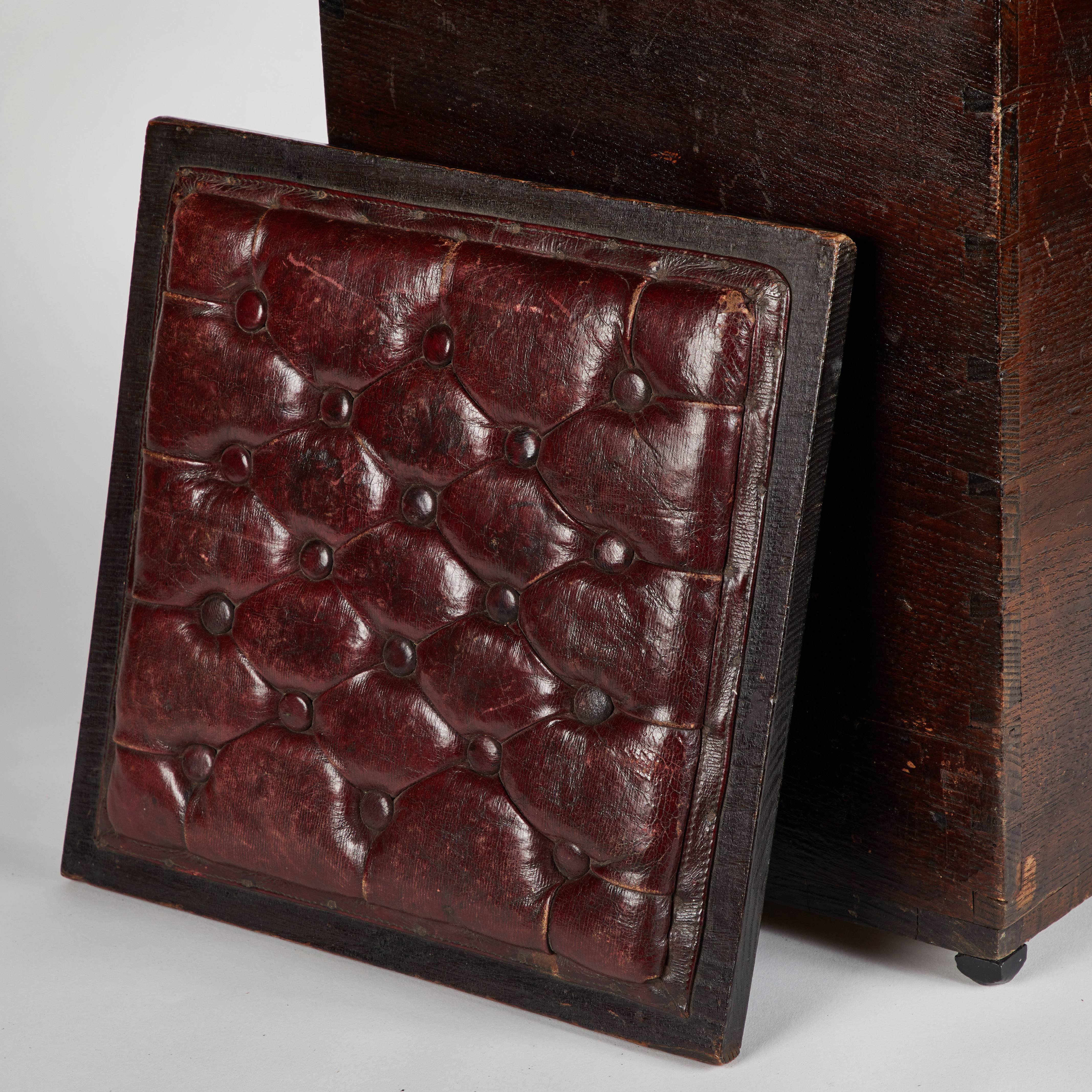 Pair of wood and tufted leather topped stools from late 19th century England. 