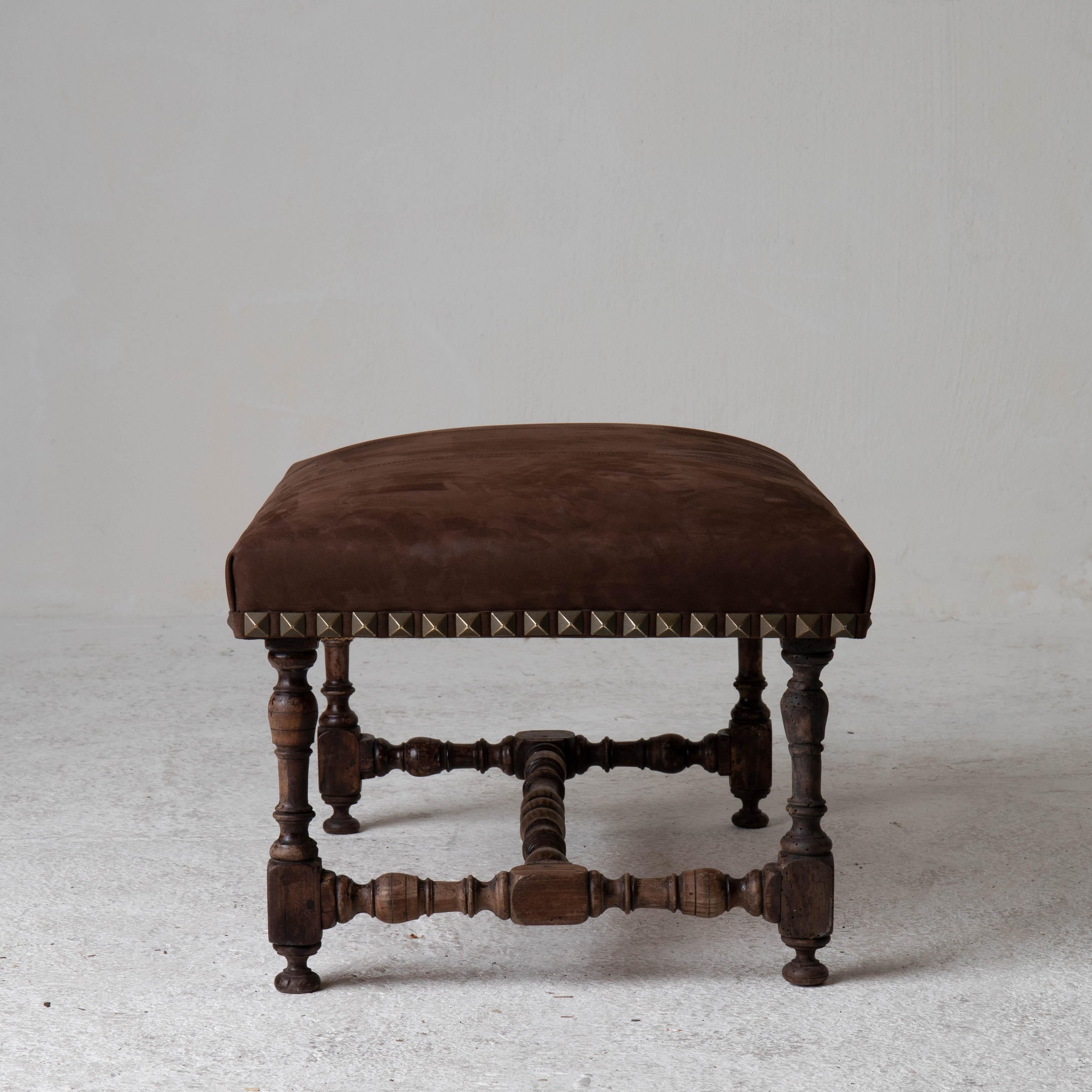 Stools pair European Baroque Period dark brown suede Europe. A pair of rectangular stools made during the Baroque period. Later upholstery and nail head details.

 