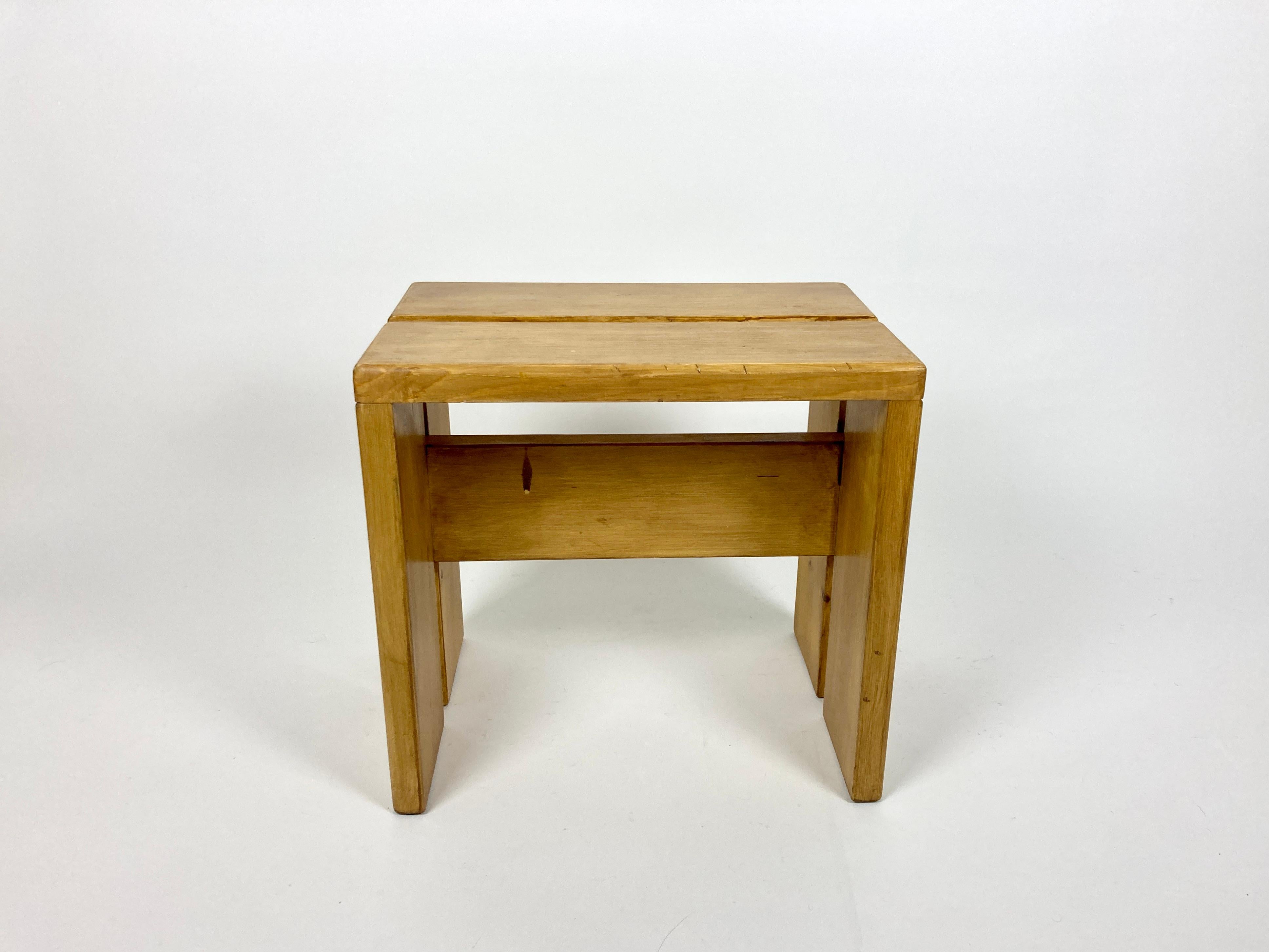 Stool/side table selected by Charlotte Perriand for the Les Arcs resort. France, 1970s.

Made of pine. No structural damage or old repairs, very solid.

Great original condition with wear and patina as pictured, nice rich wood tone. Cleaned,