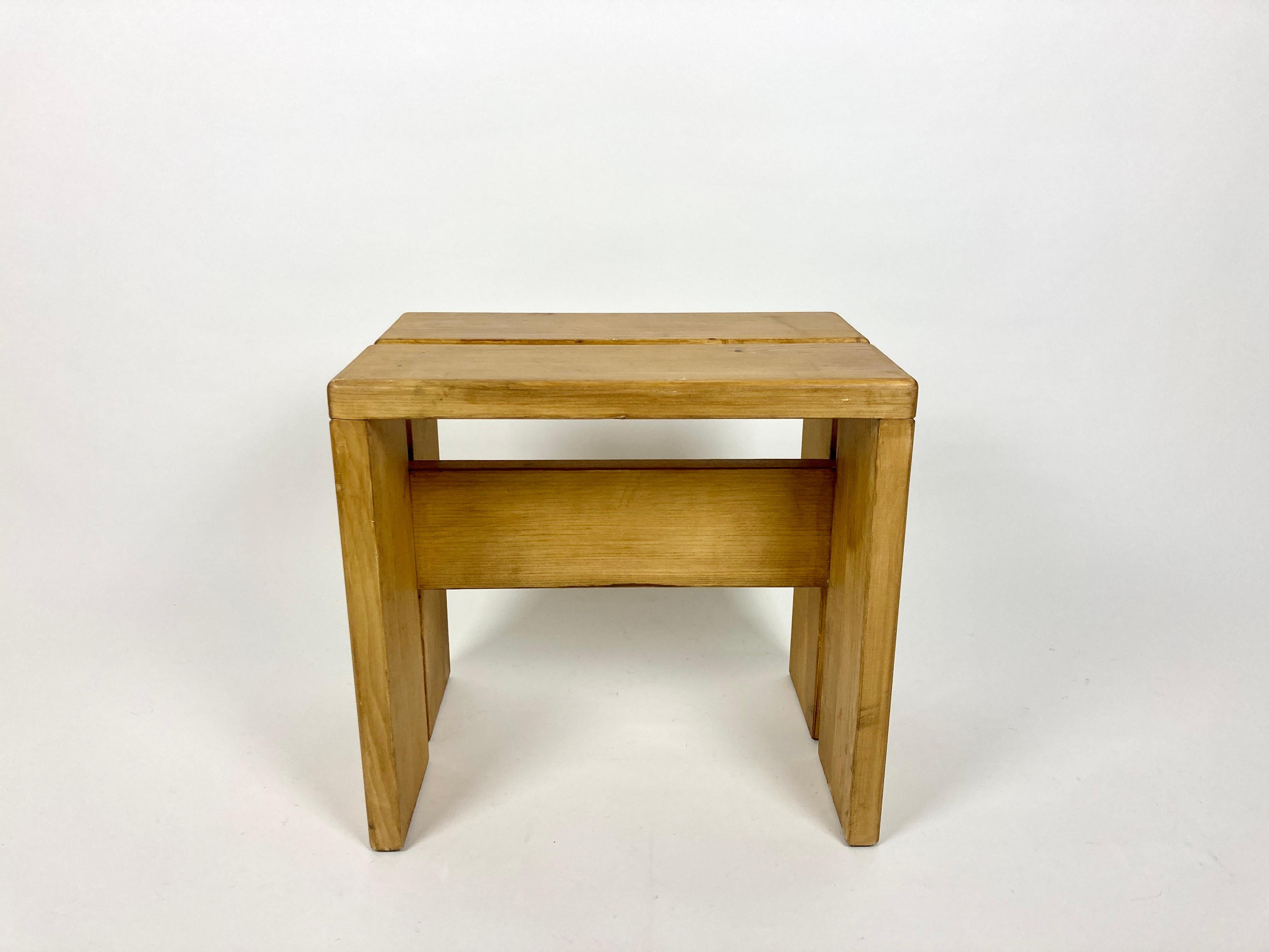 Stool/side table selected by Charlotte Perriand for the Les Arcs resort. France, 1970s.

Made of pine. No structural damage or old repairs, very solid.

Great original condition with wear and patina as pictured, nice rich wood tone. Cleaned, ready